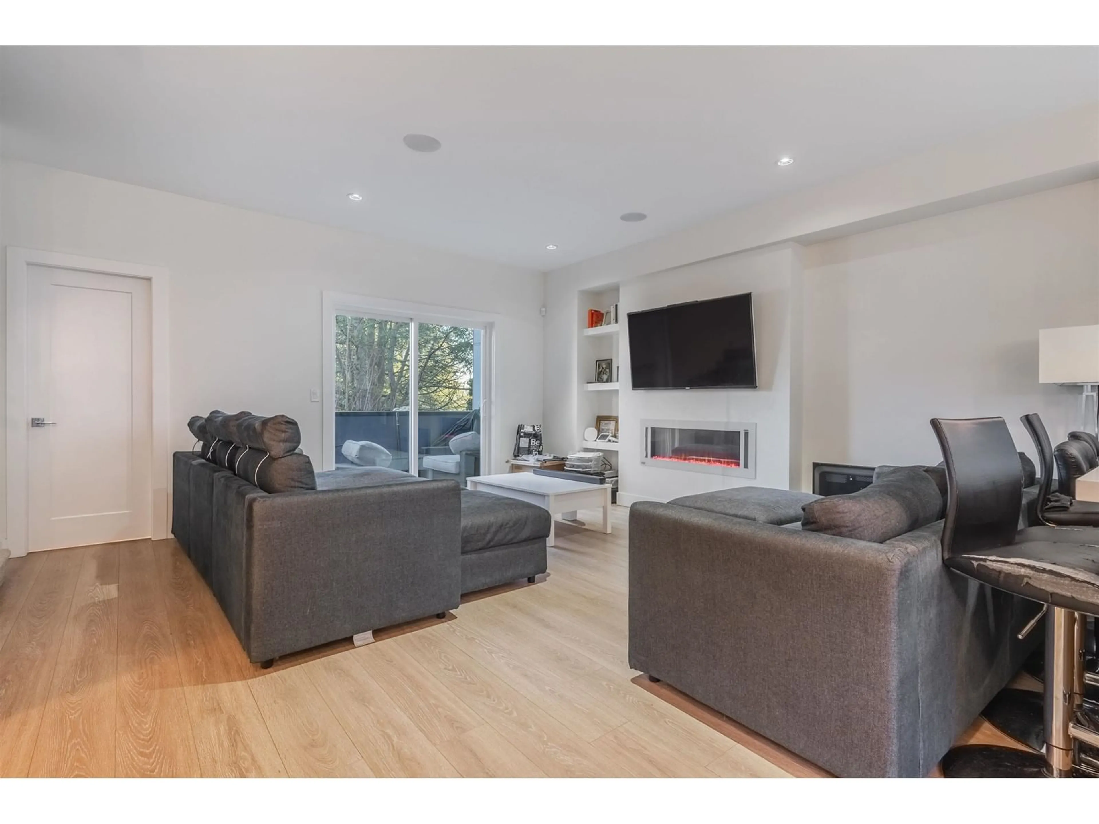 Living room with furniture, wood/laminate floor for 13 1670 160 STREET, Surrey British Columbia V4A0C6