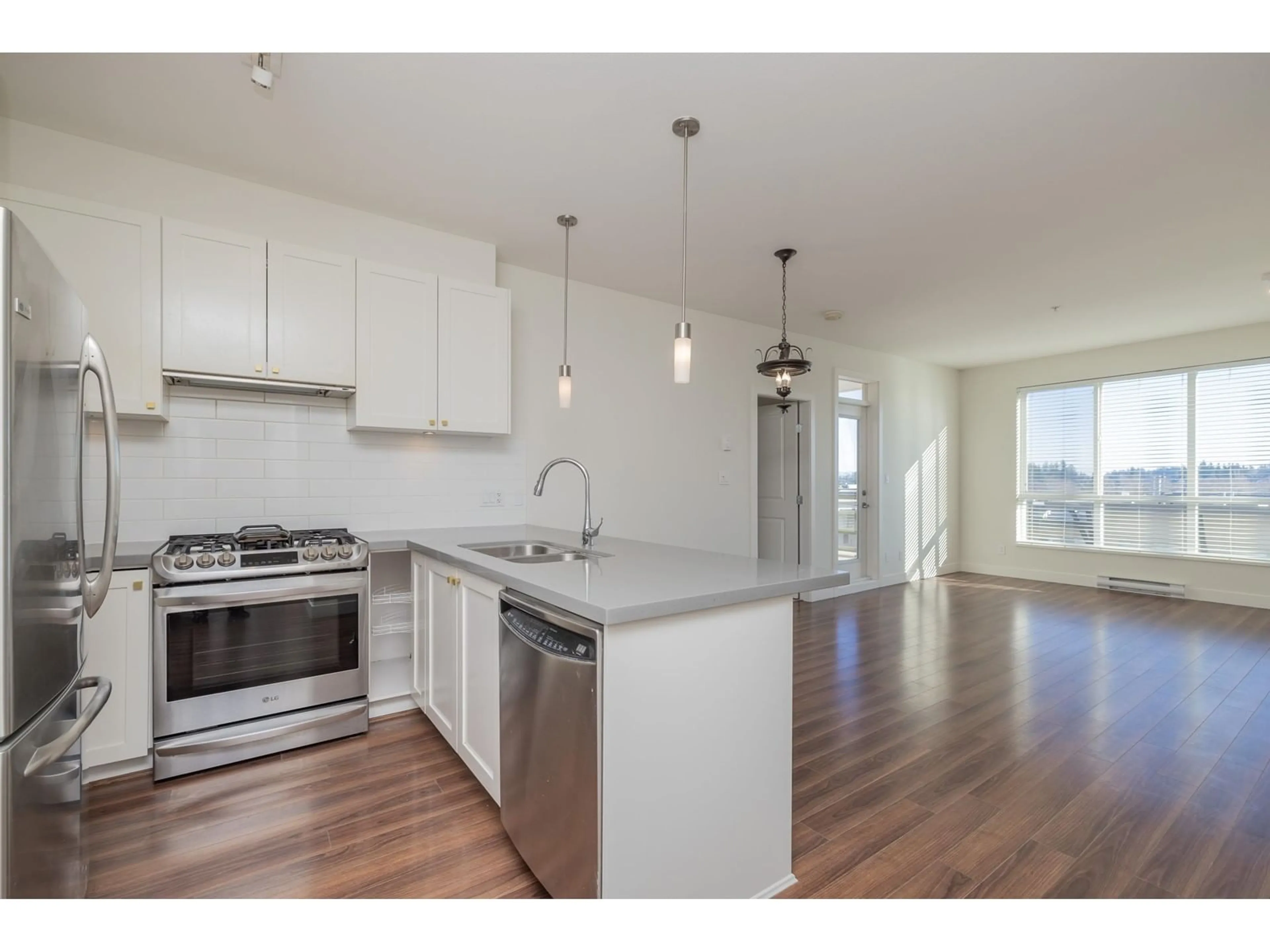 Open concept kitchen, wood/laminate floor for 221 15850 26 AVENUE, Surrey British Columbia V3Z2N6