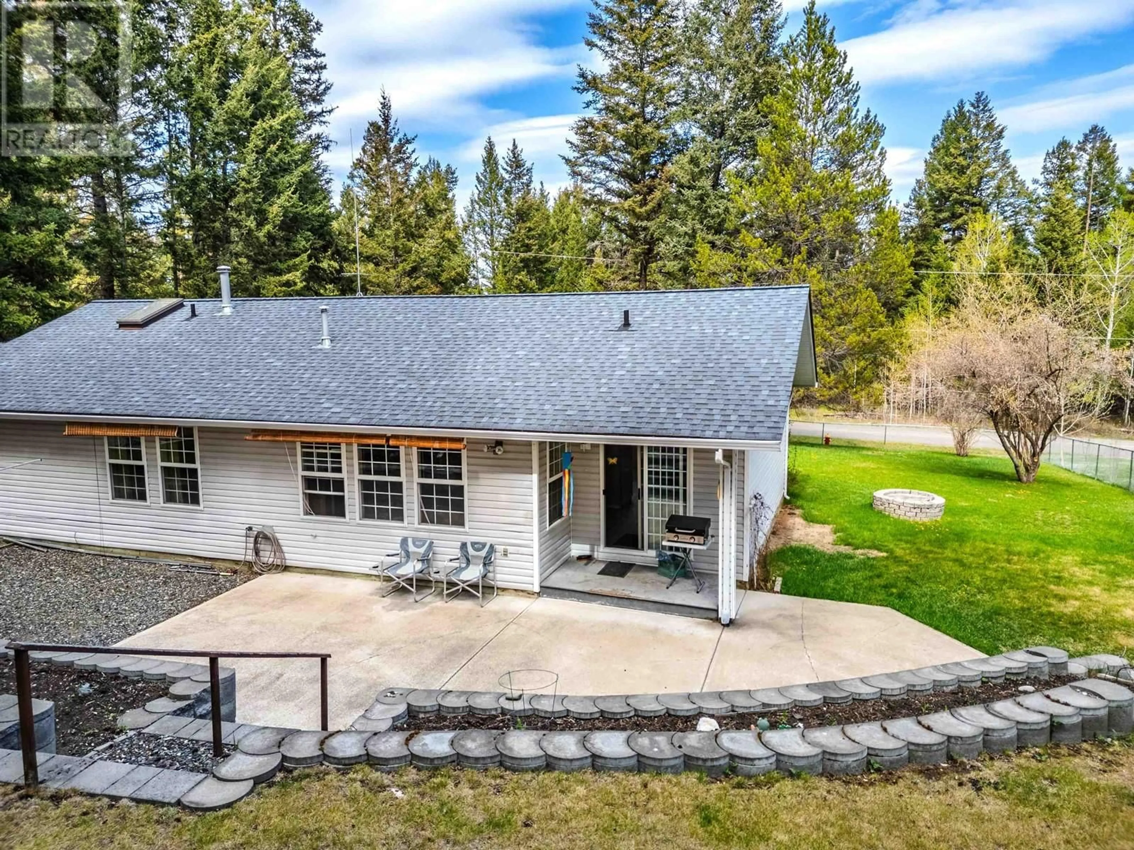 A pic from outside/outdoor area/front of a property/back of a property/a pic from drone, unknown for 5091 EASZEE DRIVE, 108 Mile Ranch British Columbia V0K2Z0