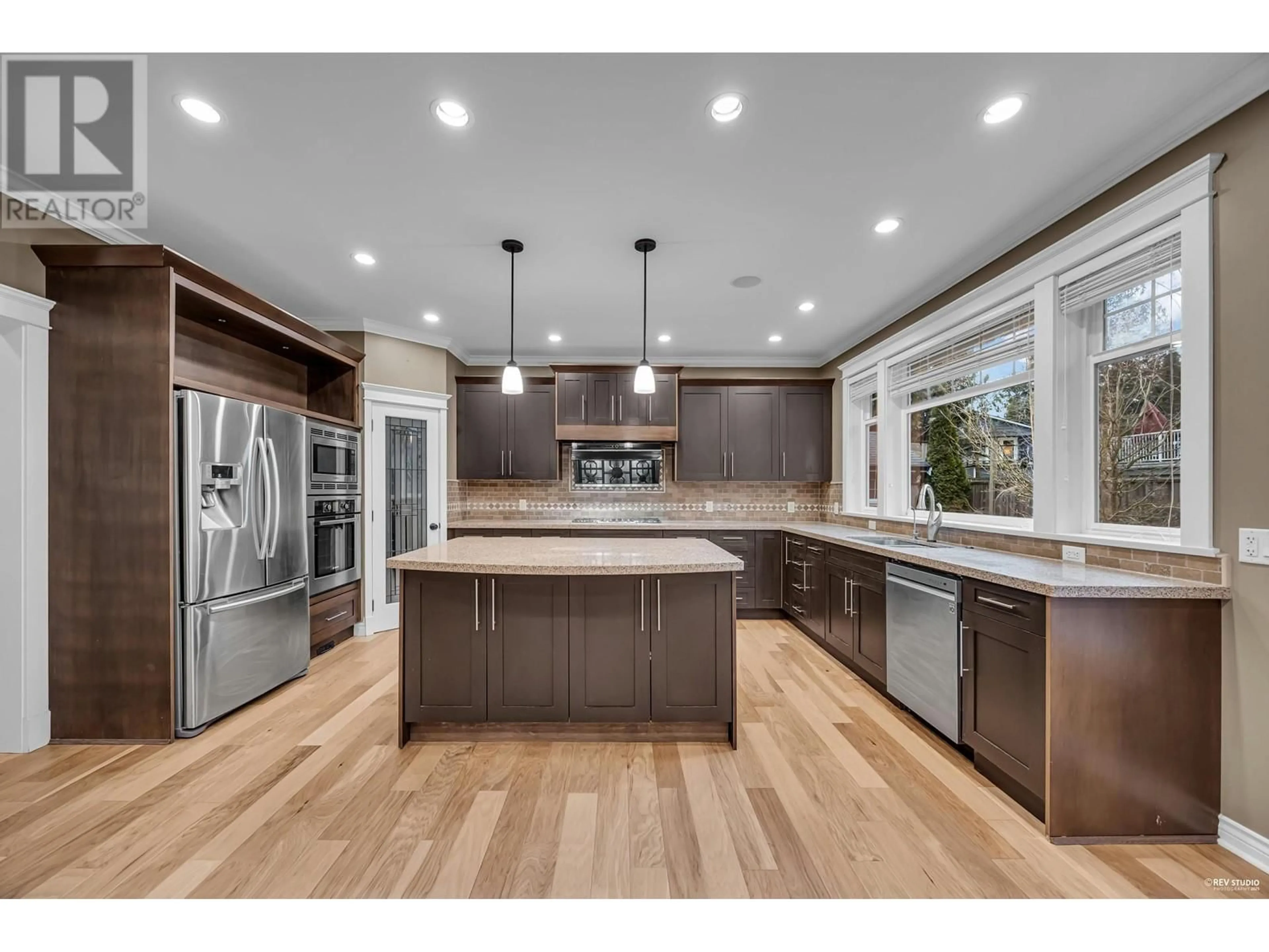 Open concept kitchen, wood/laminate floor for 4945 DOGWOOD DRIVE, Delta British Columbia V4M1M3