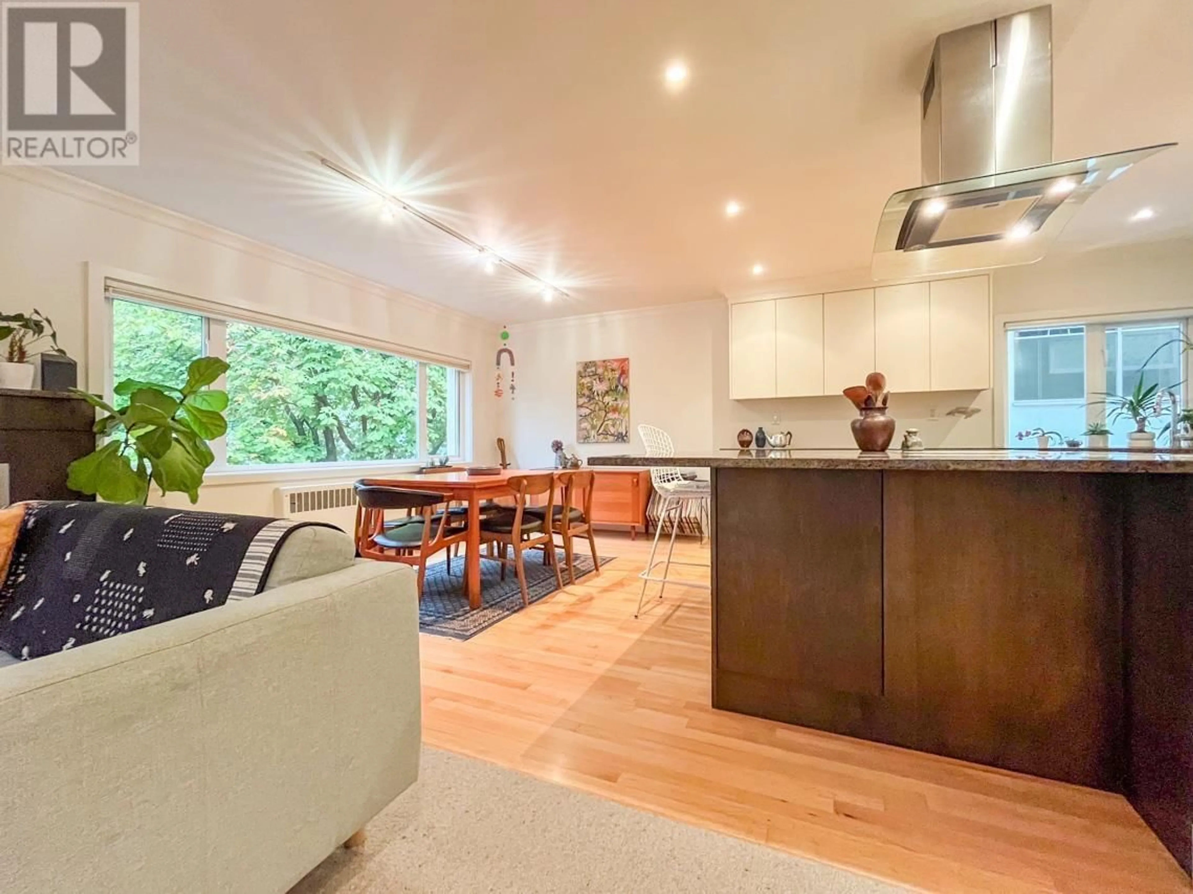 Open concept kitchen, wood/laminate floor for 201 1972 ROBSON STREET, Vancouver British Columbia V6G1E8