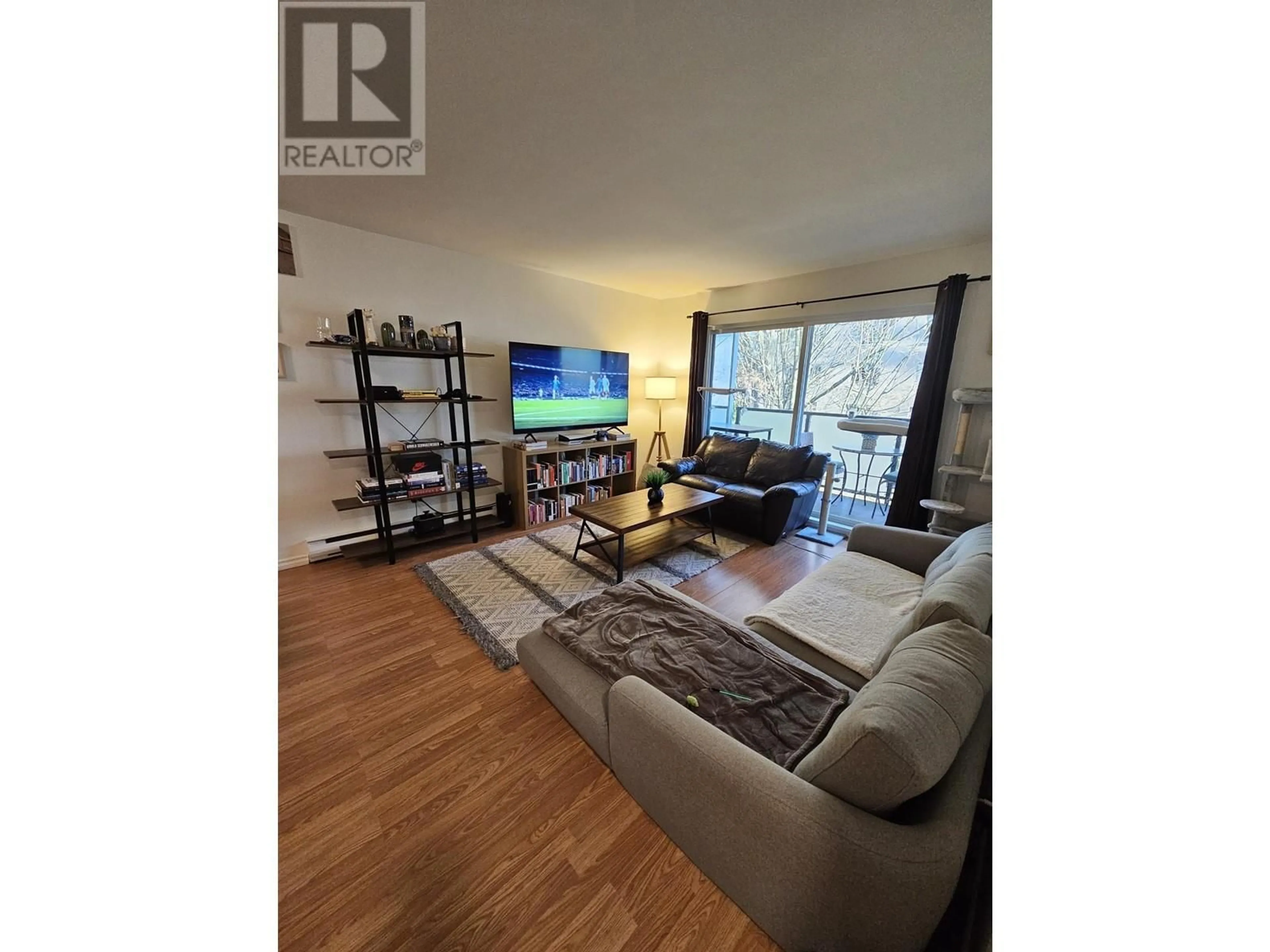 Living room with furniture, wood/laminate floor for 306 1396 BURNABY STREET, Vancouver British Columbia V6E1P9