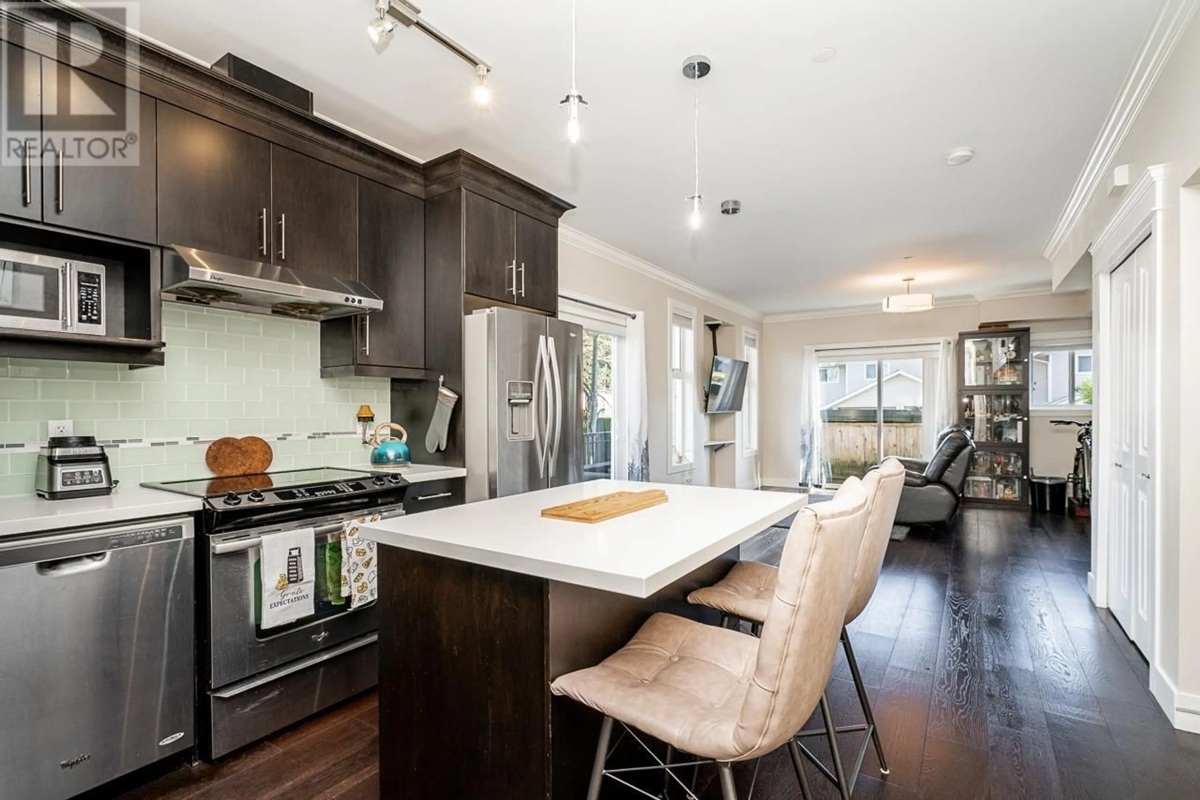 Open concept kitchen, wood/laminate floor for 104 3488 SEFTON STREET, Port Coquitlam British Columbia V3B3R2