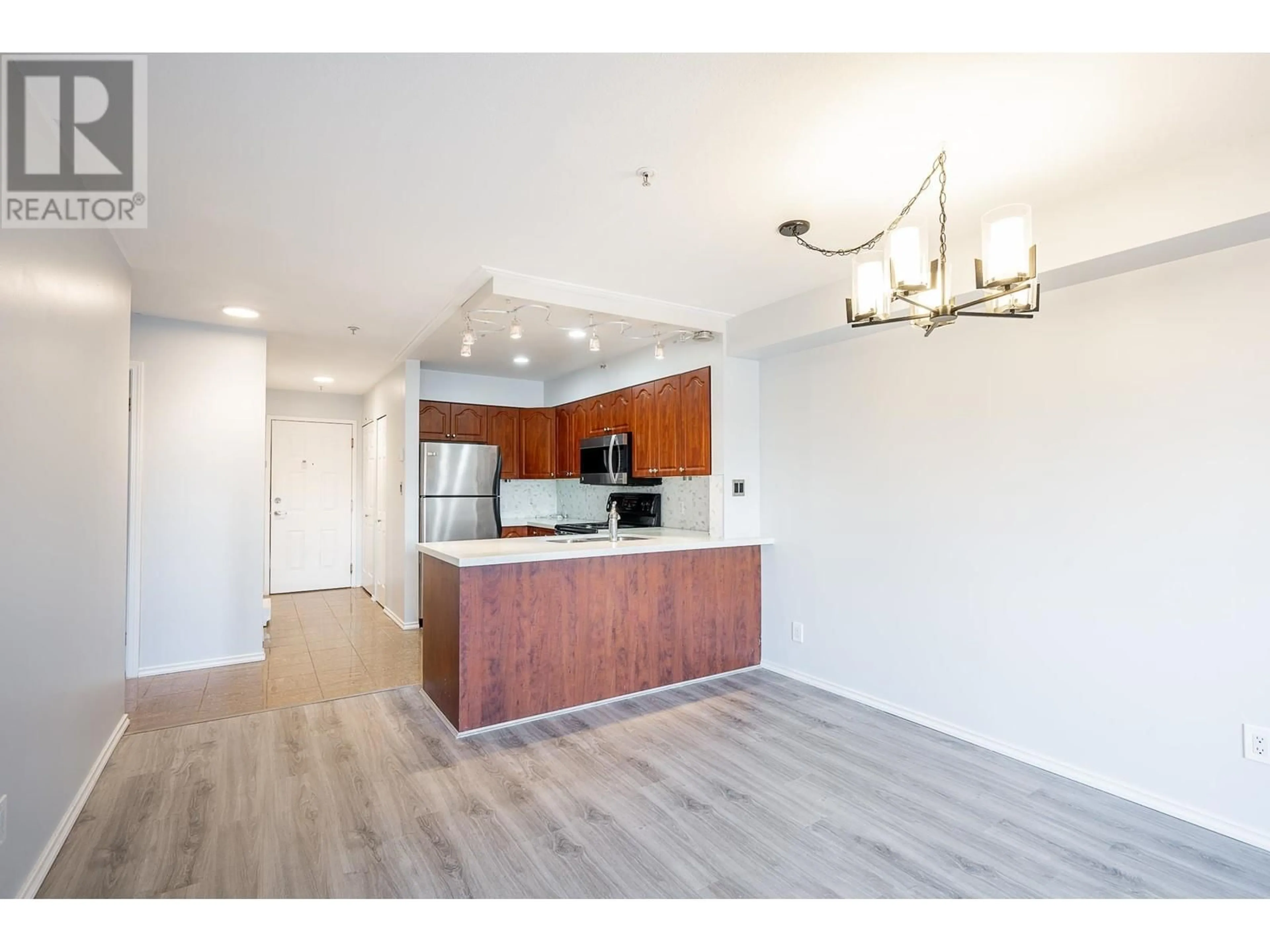 Open concept kitchen, wood/laminate floor for 208 633 W 16TH AVENUE, Vancouver British Columbia V5Z1S5