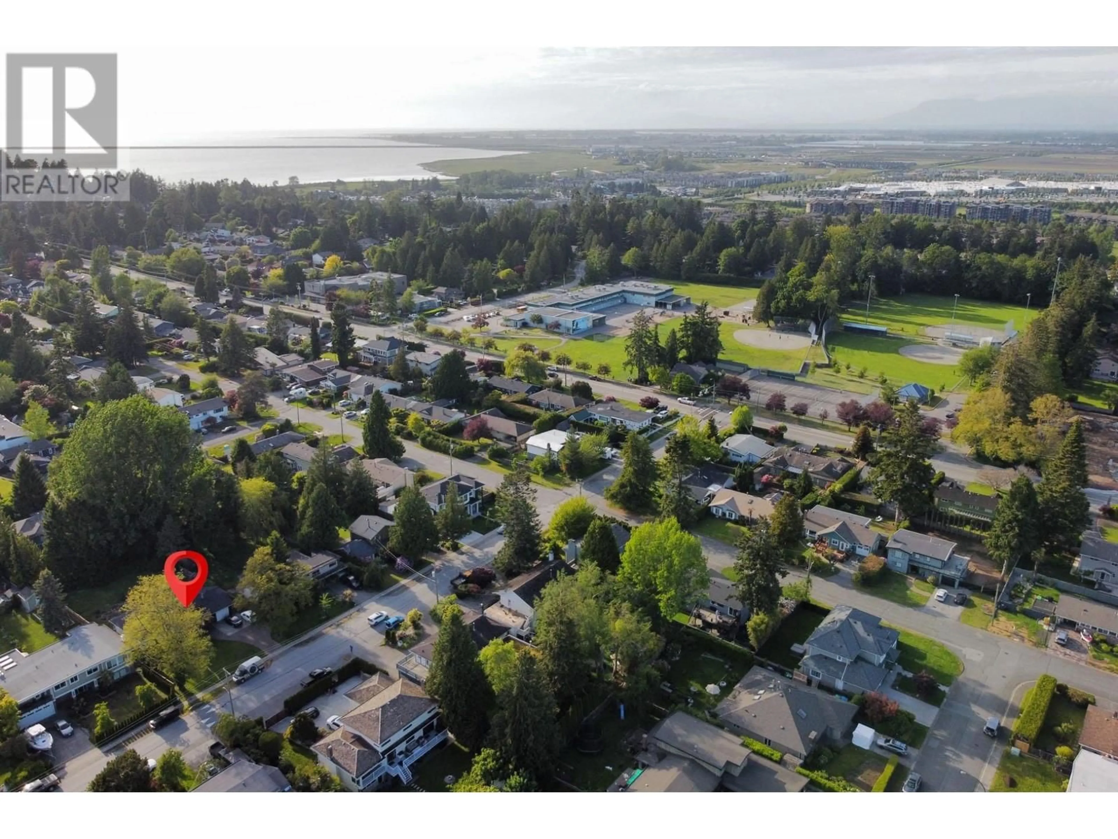 A pic from outside/outdoor area/front of a property/back of a property/a pic from drone, water/lake/river/ocean view for 1111 50B STREET, Delta British Columbia V4M2W2