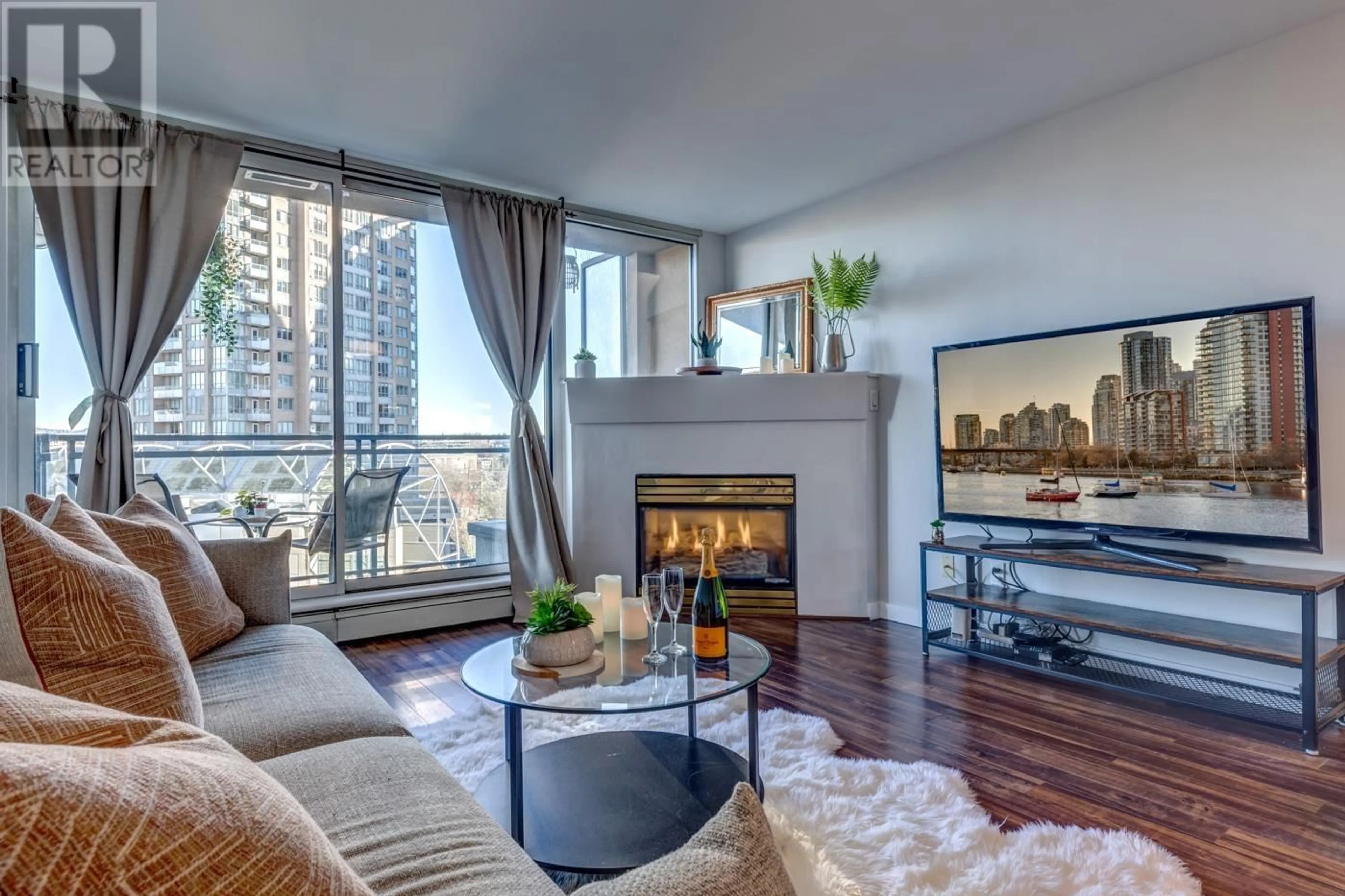 Living room with furniture, wood/laminate floor for 809 555 ABBOTT STREET, Vancouver British Columbia V6B6B8