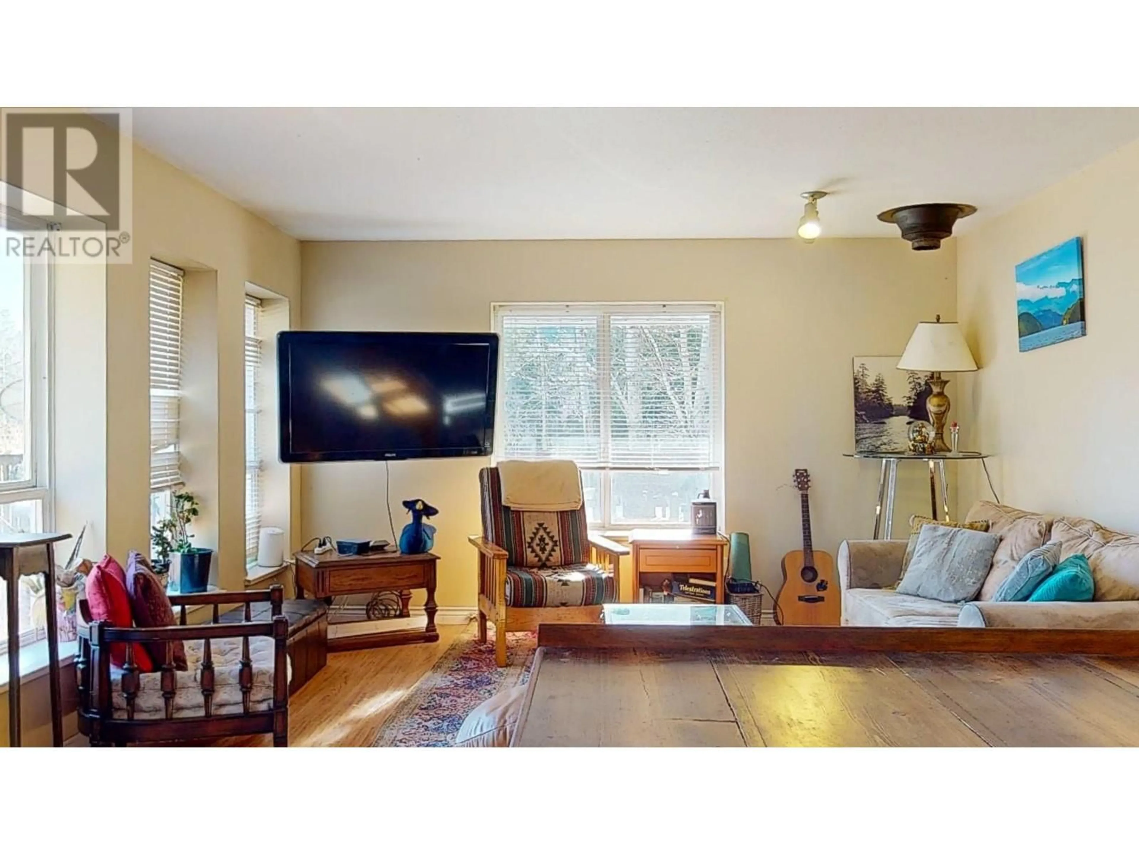 Living room with furniture, wood/laminate floor for 6808 MAPLE ROAD, Egmont British Columbia V0N1N0