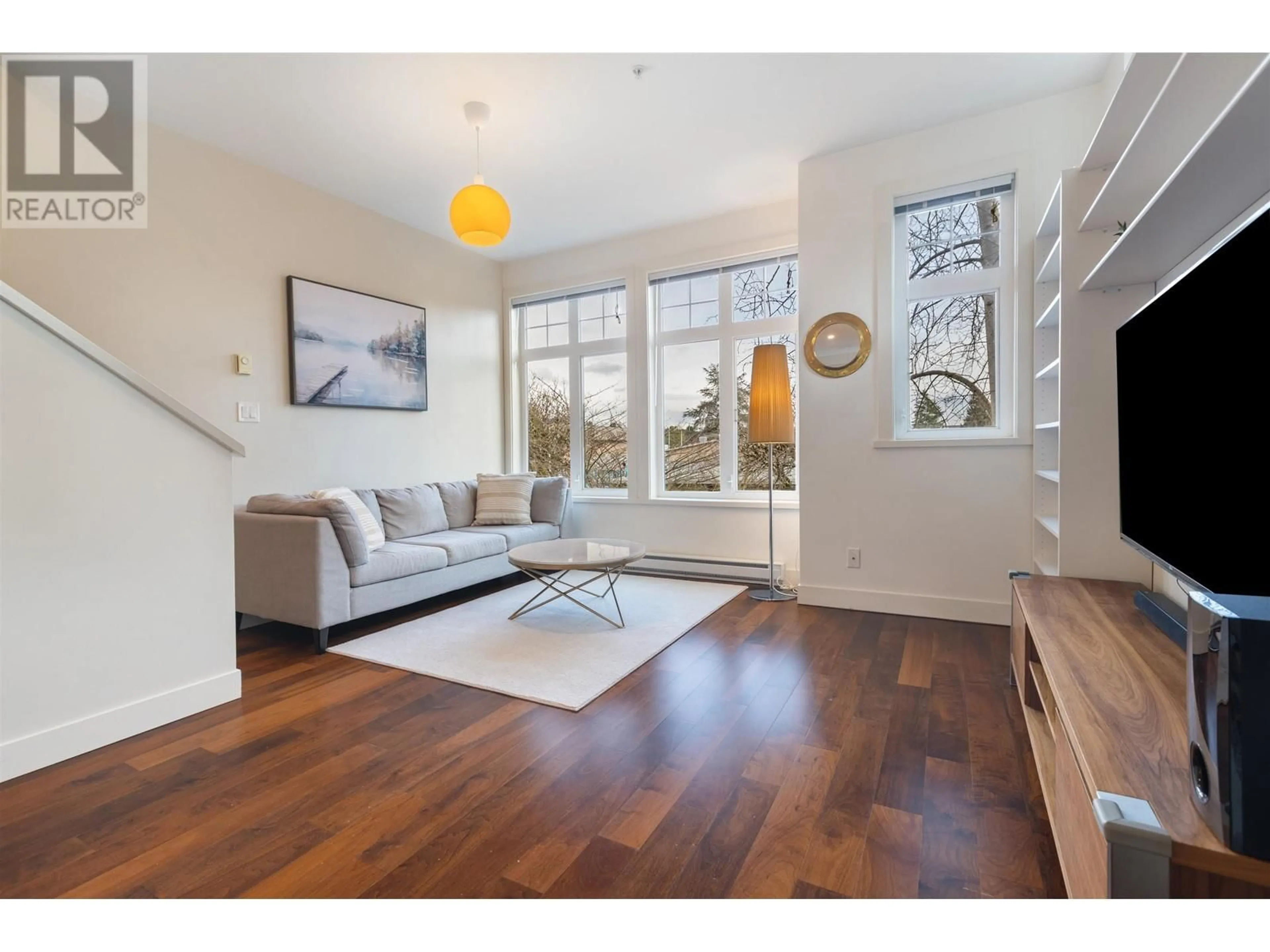 Living room with furniture, wood/laminate floor for 5437 WILLOW STREET, Vancouver British Columbia V5Z3S3