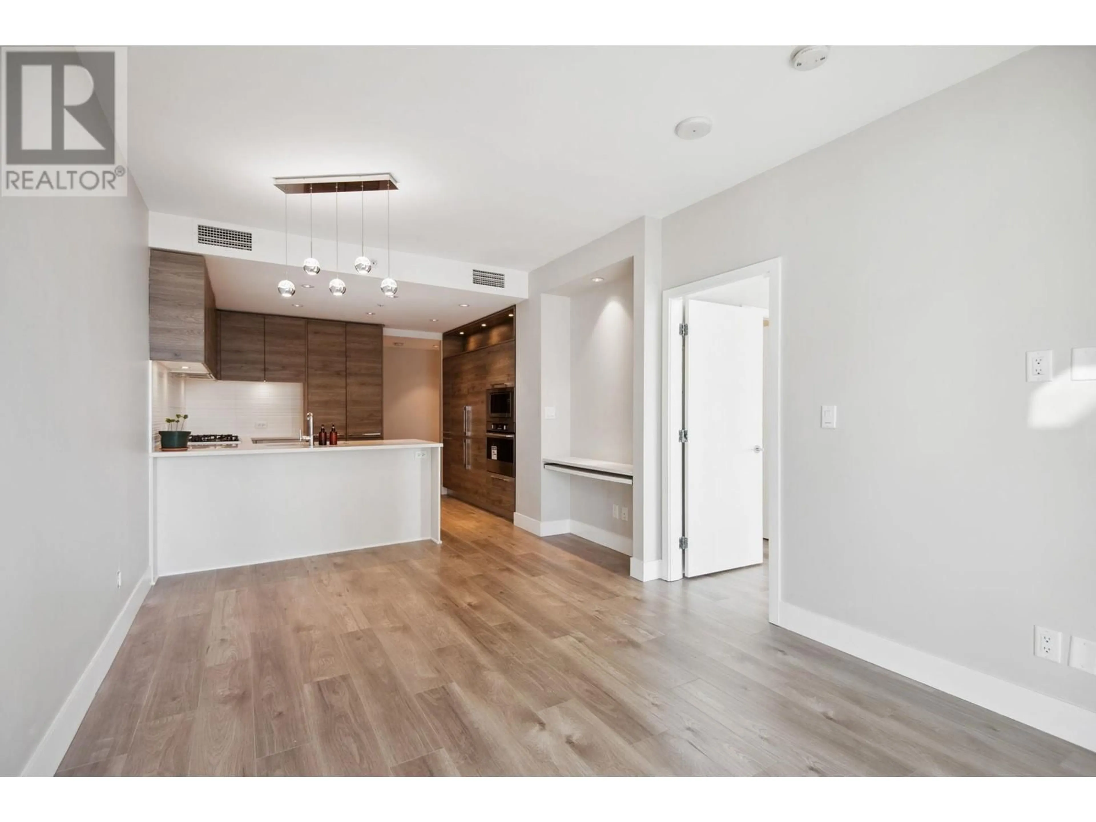 Open concept kitchen, wood/laminate floor for 1711 7303 NOBLE LANE, Burnaby British Columbia V3N0H2