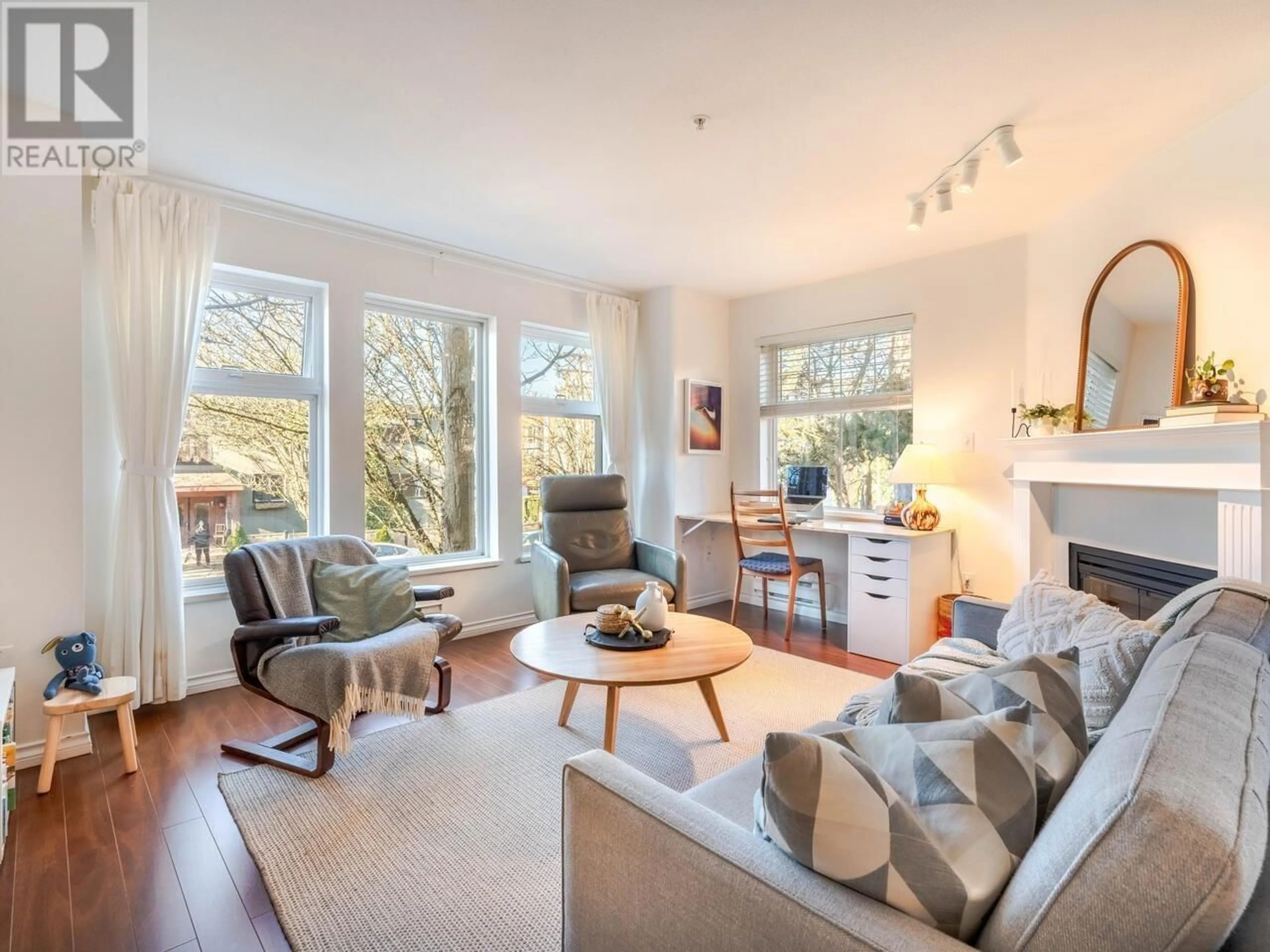 Living room with furniture, wood/laminate floor for 201 1915 E GEORGIA STREET, Vancouver British Columbia V5L2B7