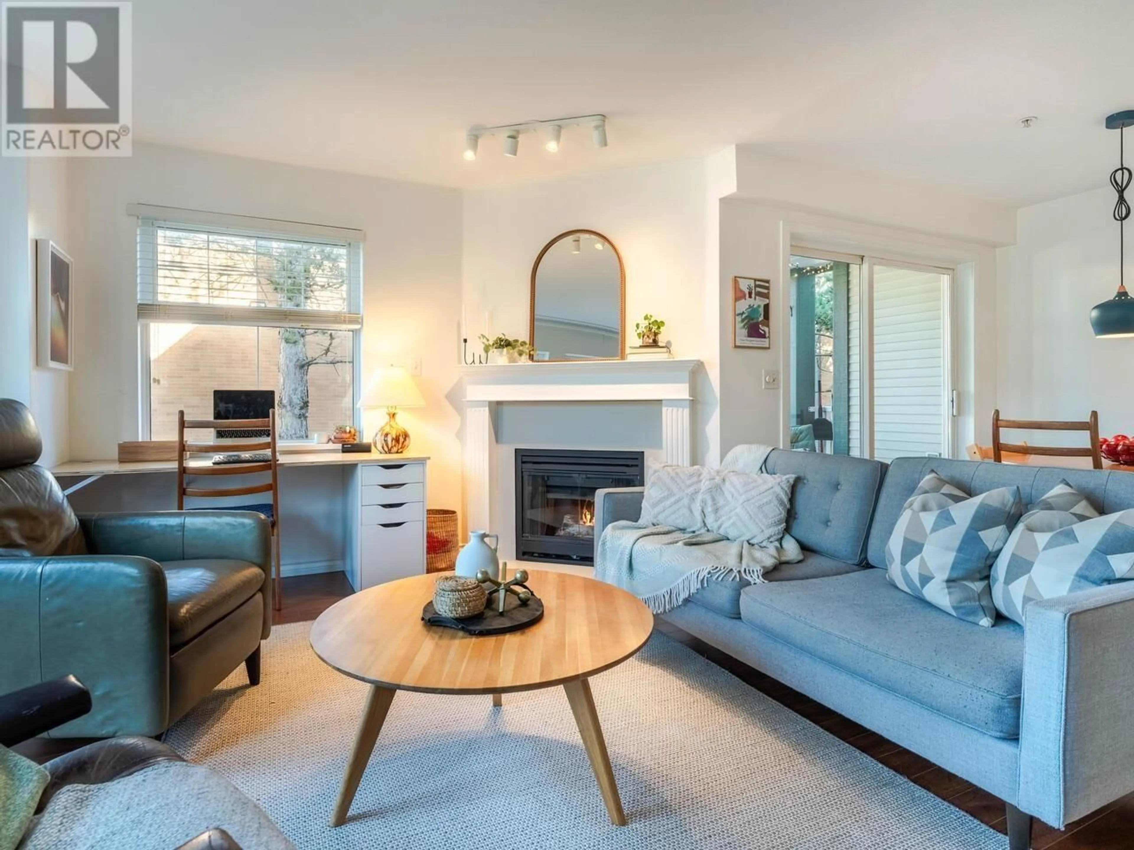 Living room with furniture, wood/laminate floor for 201 1915 E GEORGIA STREET, Vancouver British Columbia V5L2B7