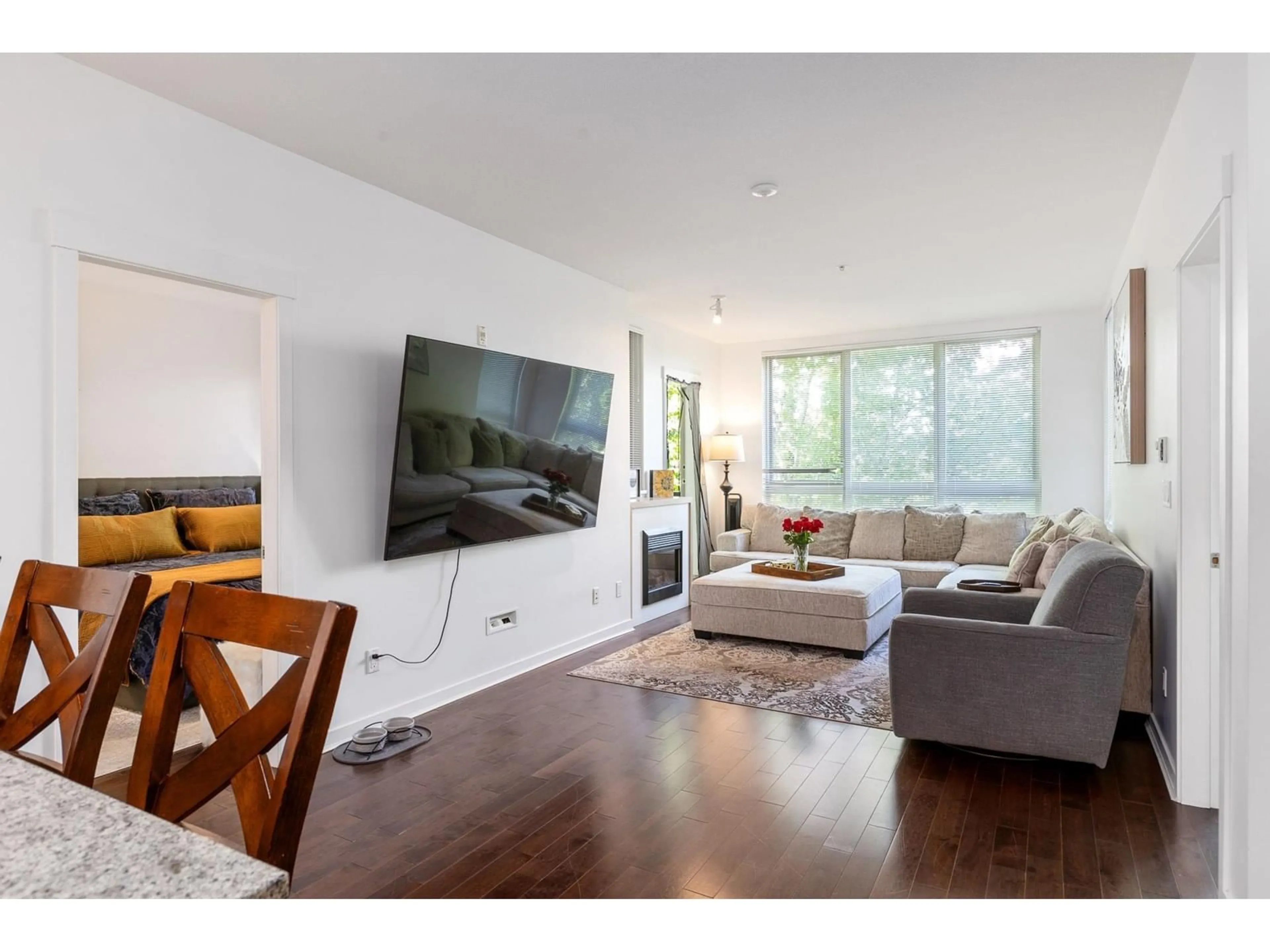 Living room with furniture, wood/laminate floor for 312 - 15918 26, Surrey British Columbia V3Z5K3