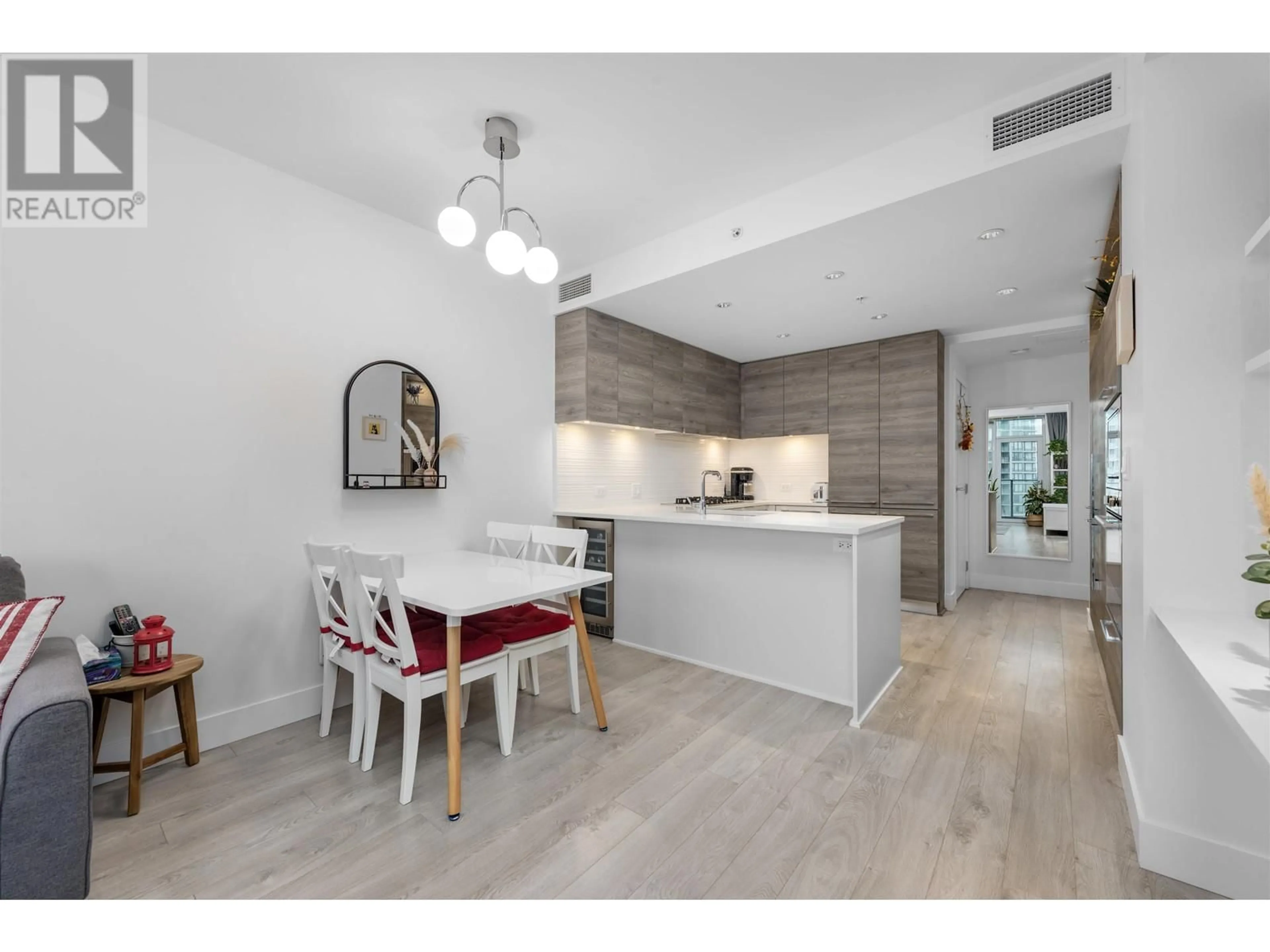 Open concept kitchen, wood/laminate floor for 1711 7388 KINGSWAY STREET, Burnaby British Columbia V3N0G9