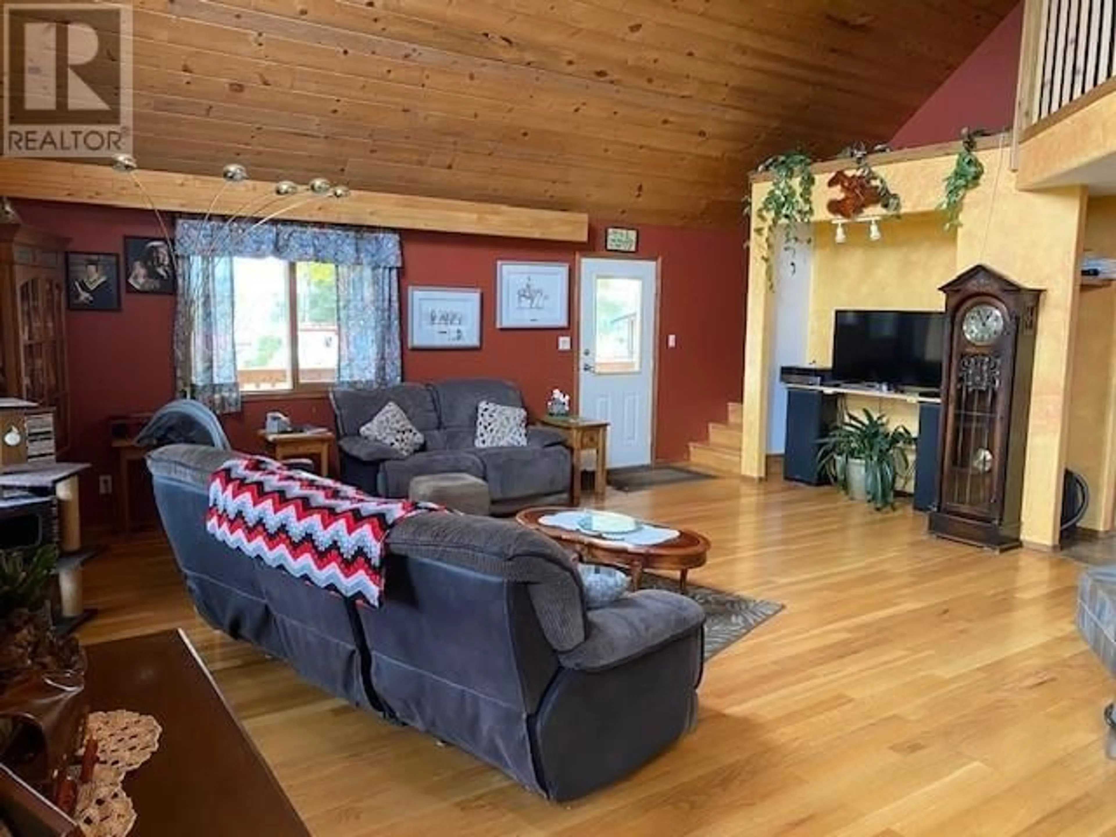 Living room with furniture, wood/laminate floor for 29850 W 16 HIGHWAY, Burns Lake British Columbia V0J1E0