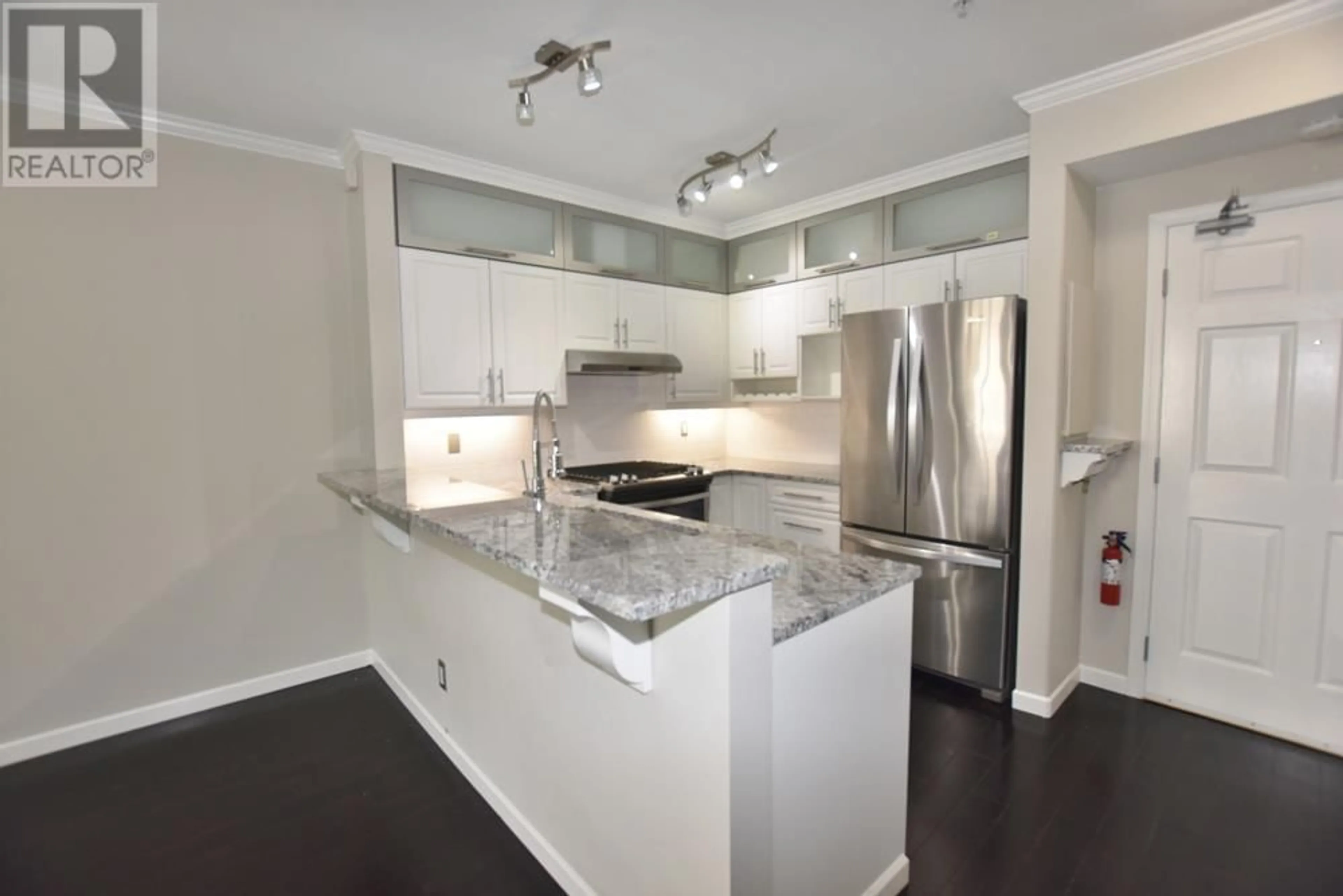 Open concept kitchen, wood/laminate floor for 408 3629 DEERCREST DRIVE, North Vancouver British Columbia V7J2S9