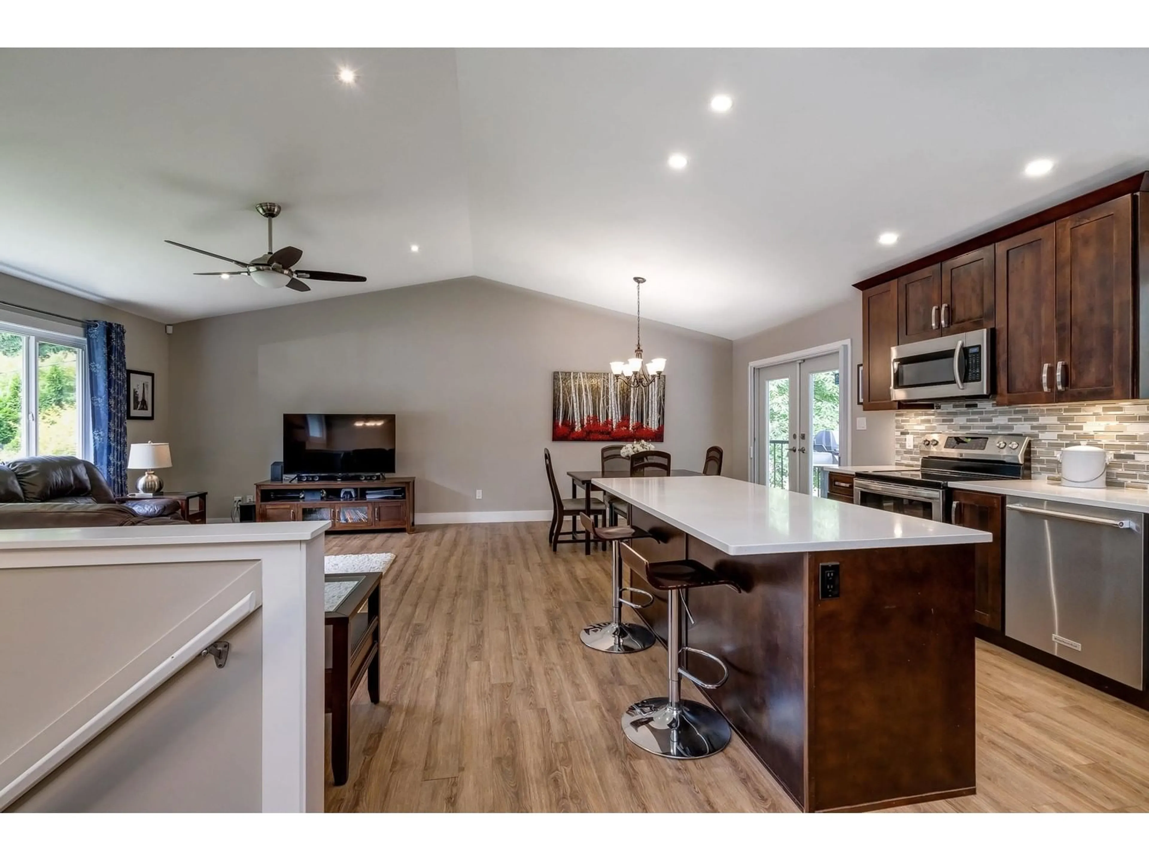 Open concept kitchen, wood/laminate floor for 19661 41A AVENUE, Langley British Columbia V3A2Z5