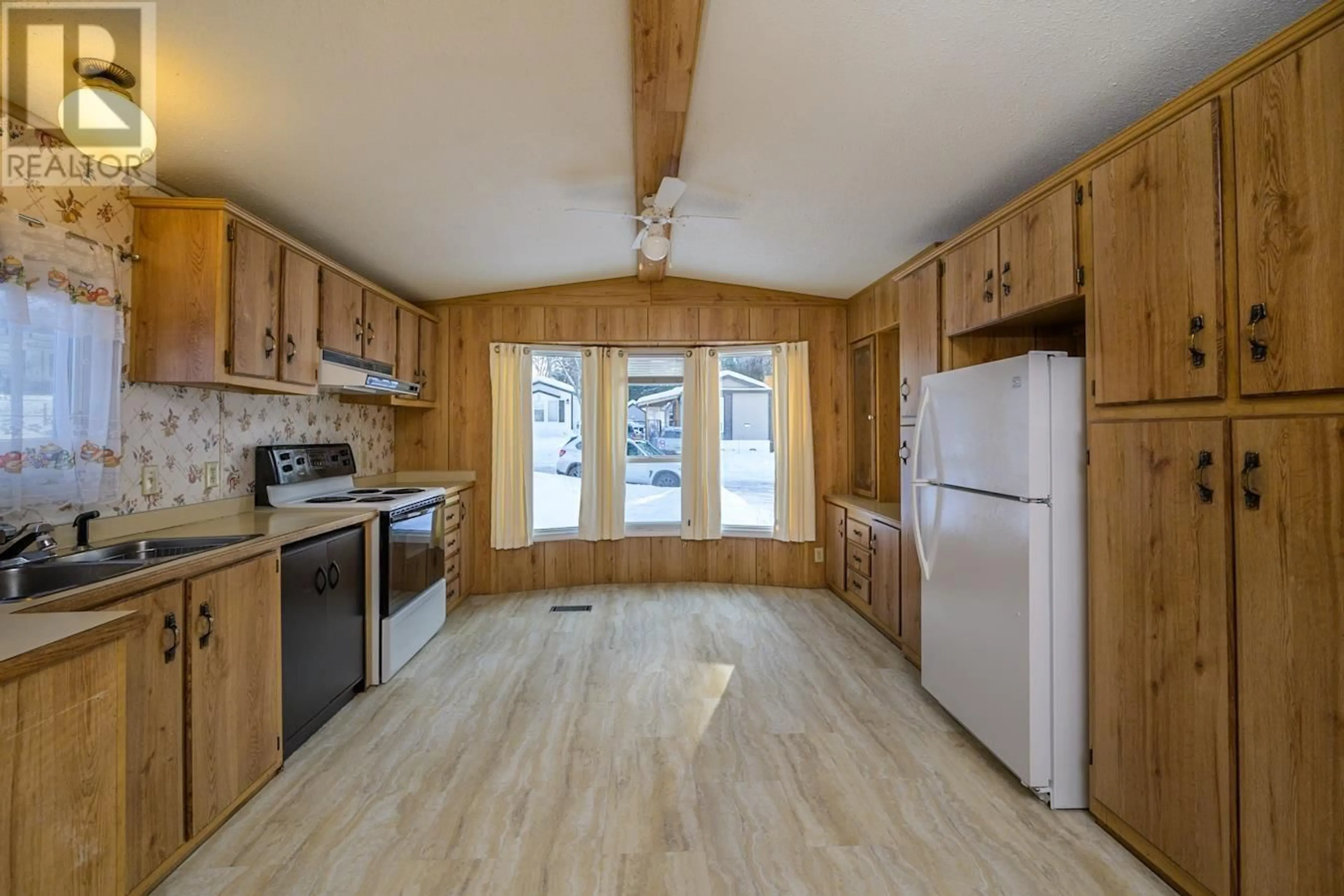 Standard kitchen, wood/laminate floor for 102 1000 INVERNESS ROAD, Prince George British Columbia V2K4V2