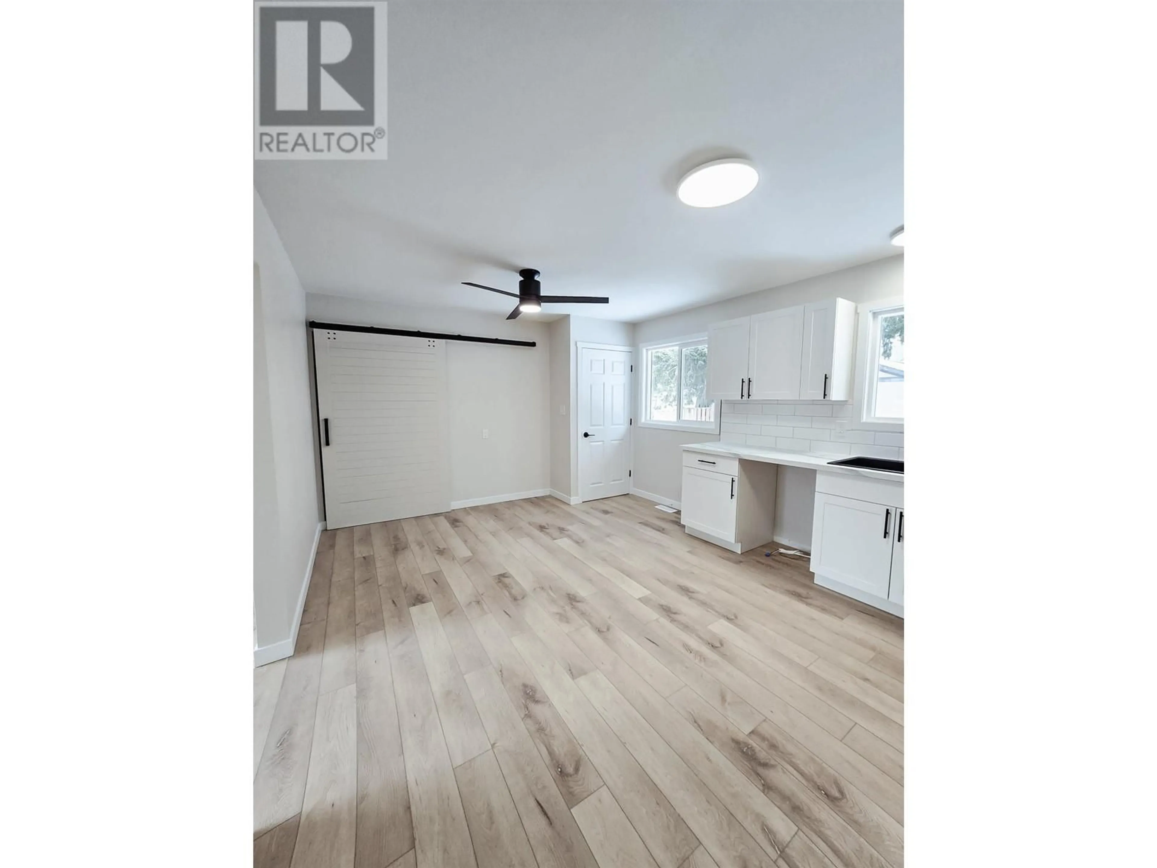 Open concept kitchen, wood/laminate floor for 123 MCQUEEN CRESCENT, Prince George British Columbia V2M4R7