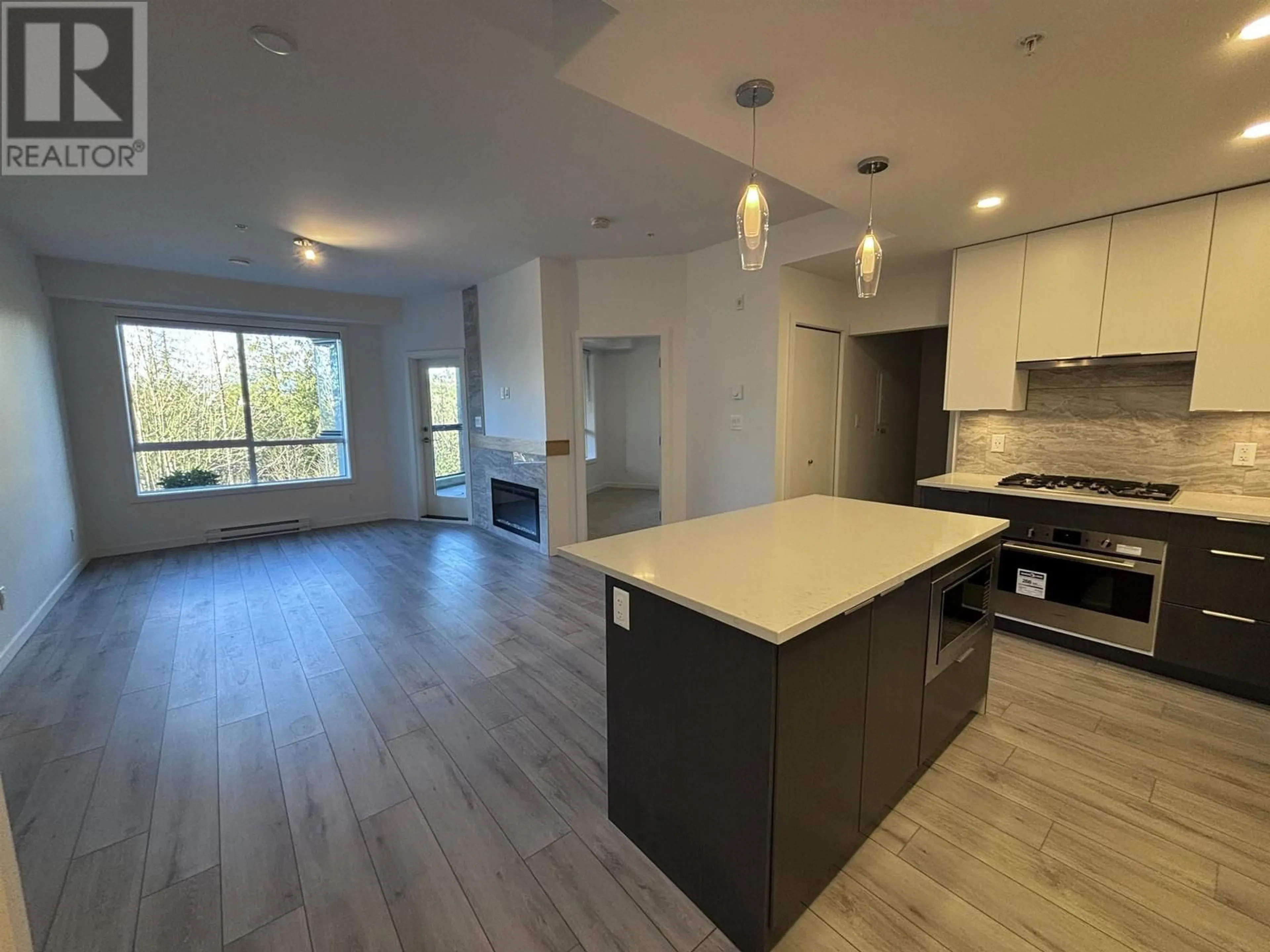 Open concept kitchen, wood/laminate floor for 104 11639 227 STREET, Maple Ridge British Columbia V2X9J6