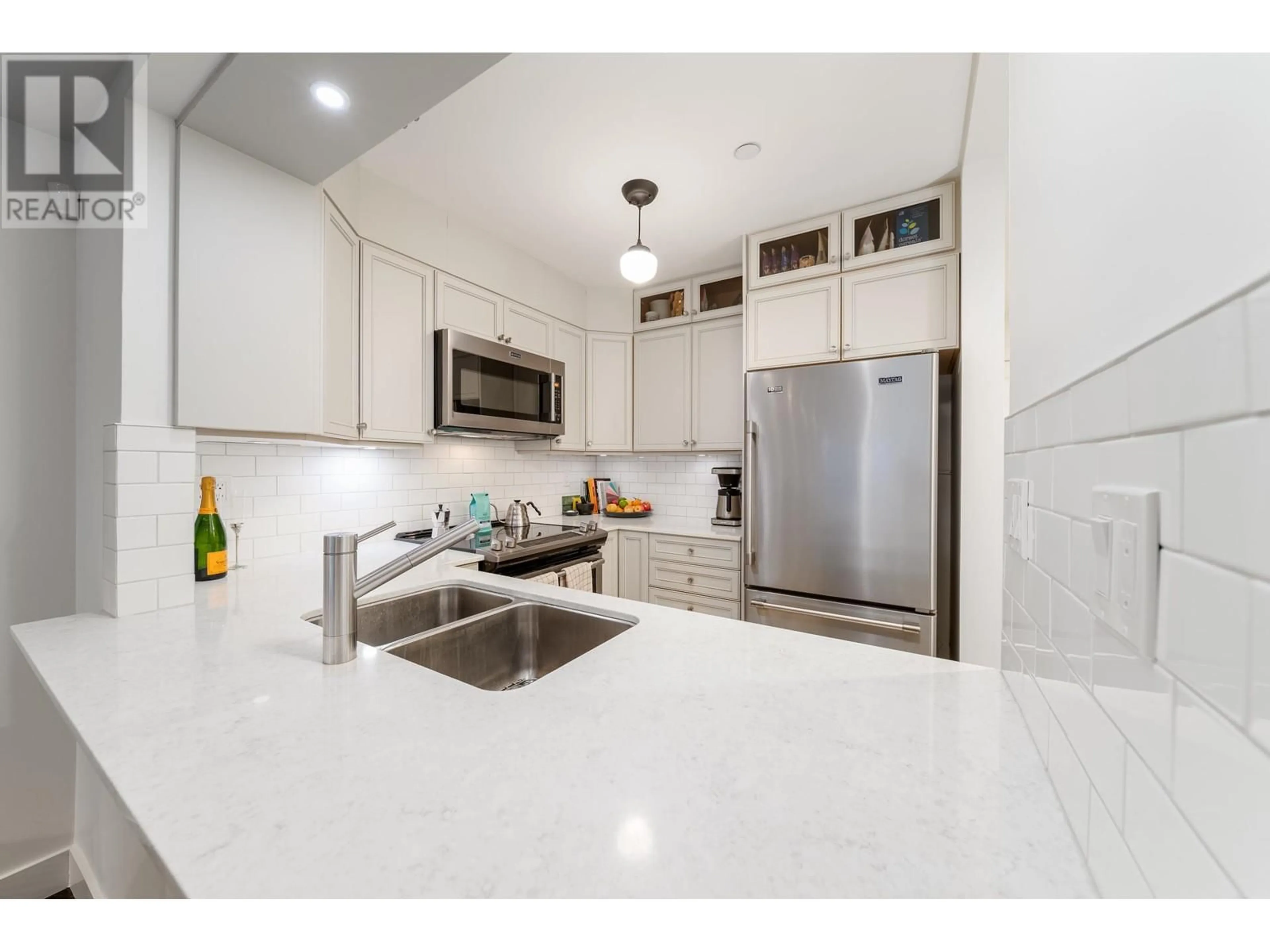 Open concept kitchen, ceramic/tile floor for 103 2130 W 12TH AVENUE, Vancouver British Columbia V6K2N2