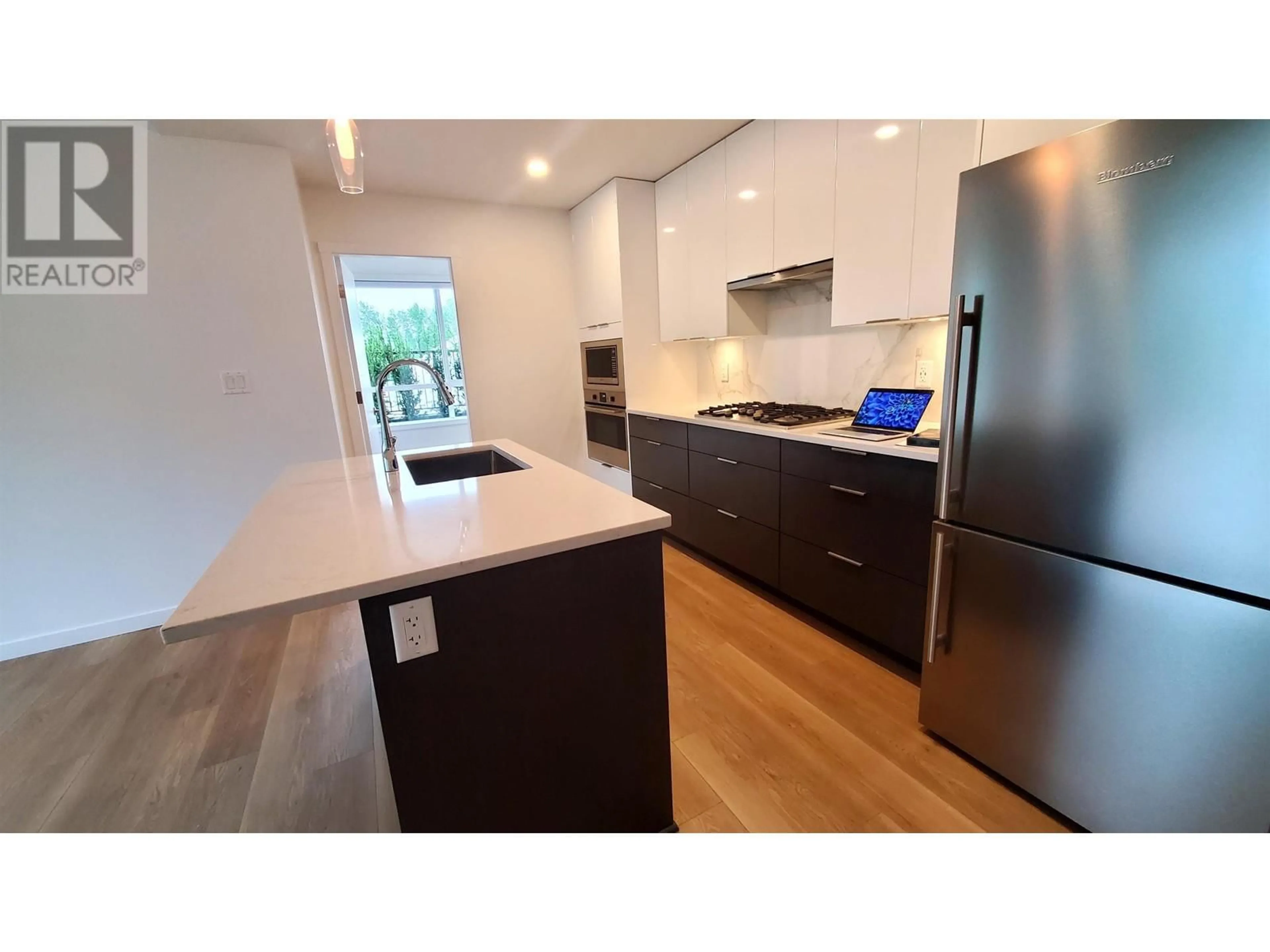 Open concept kitchen, wood/laminate floor for 116 11641 227 STREET, Maple Ridge British Columbia V2X9J6