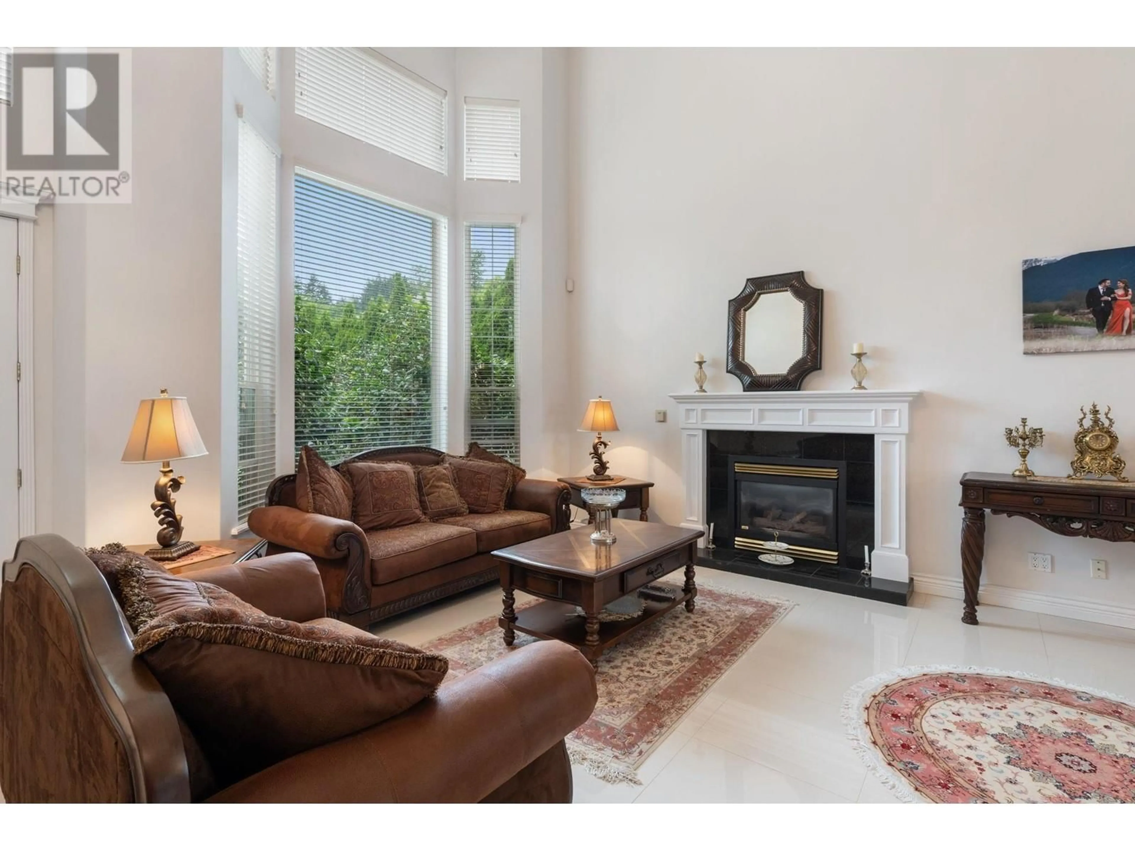 Living room with furniture, ceramic/tile floor for 1569 PINETREE WAY, Coquitlam British Columbia V3E3B5