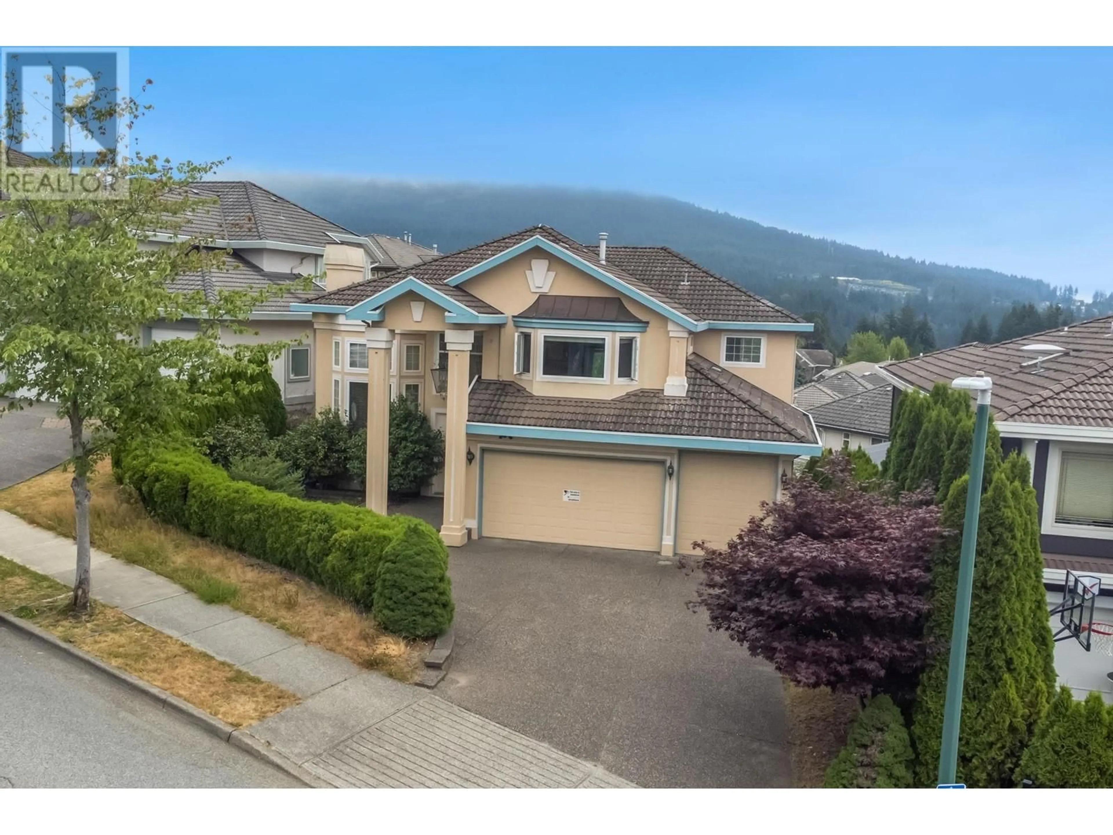 A pic from outside/outdoor area/front of a property/back of a property/a pic from drone, mountain view for 1569 PINETREE WAY, Coquitlam British Columbia V3E3B5