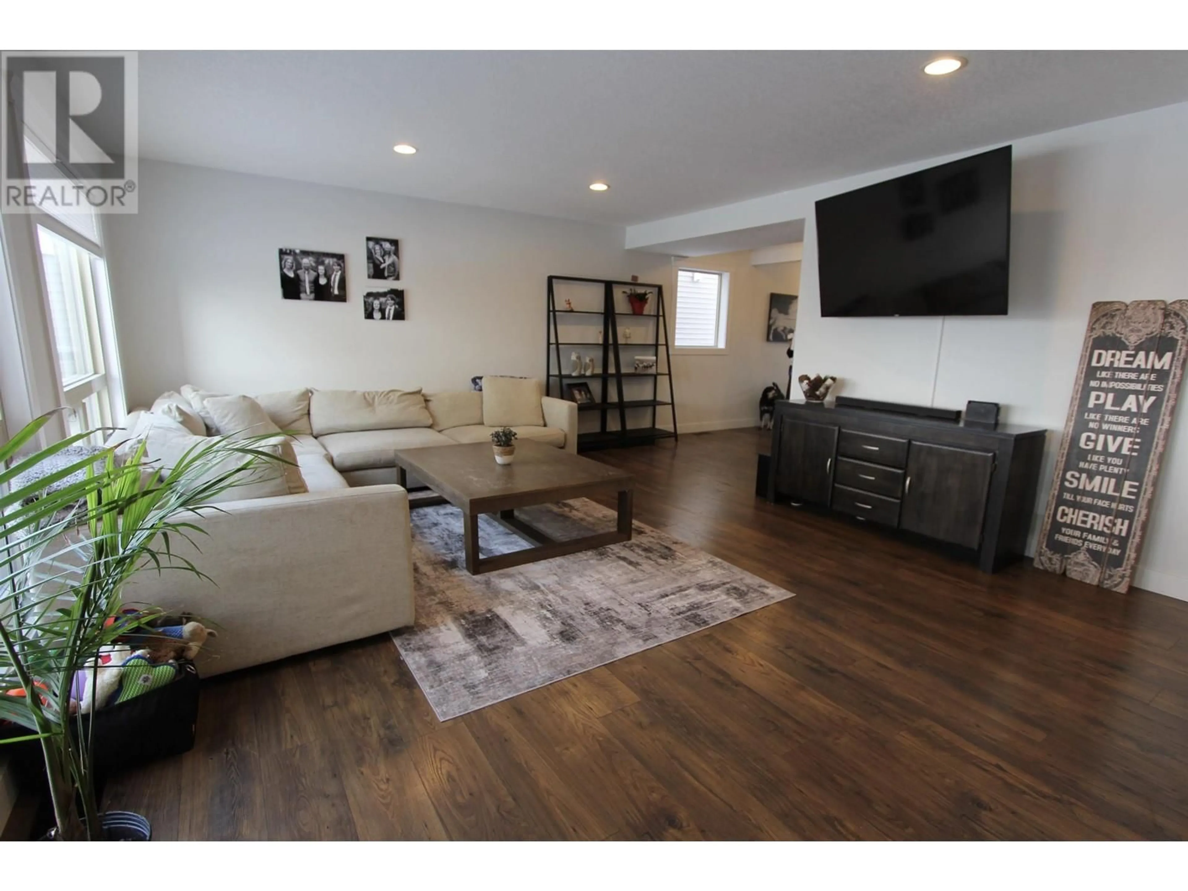 Living room with furniture, wood/laminate floor for 7675 STILLWATER CRESCENT, Prince George British Columbia V2N0C2