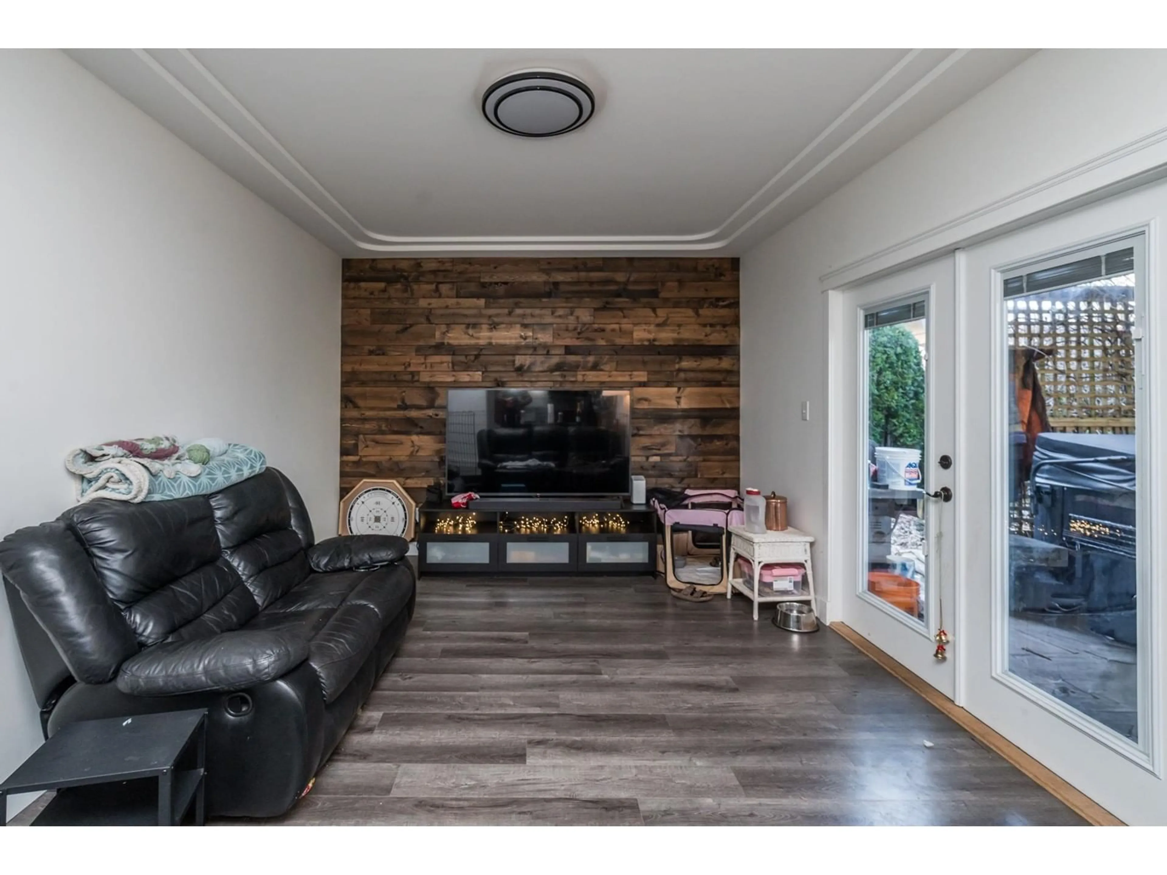 Living room with furniture, wood/laminate floor for 18822 63A AVENUE, Surrey British Columbia V3S7W3