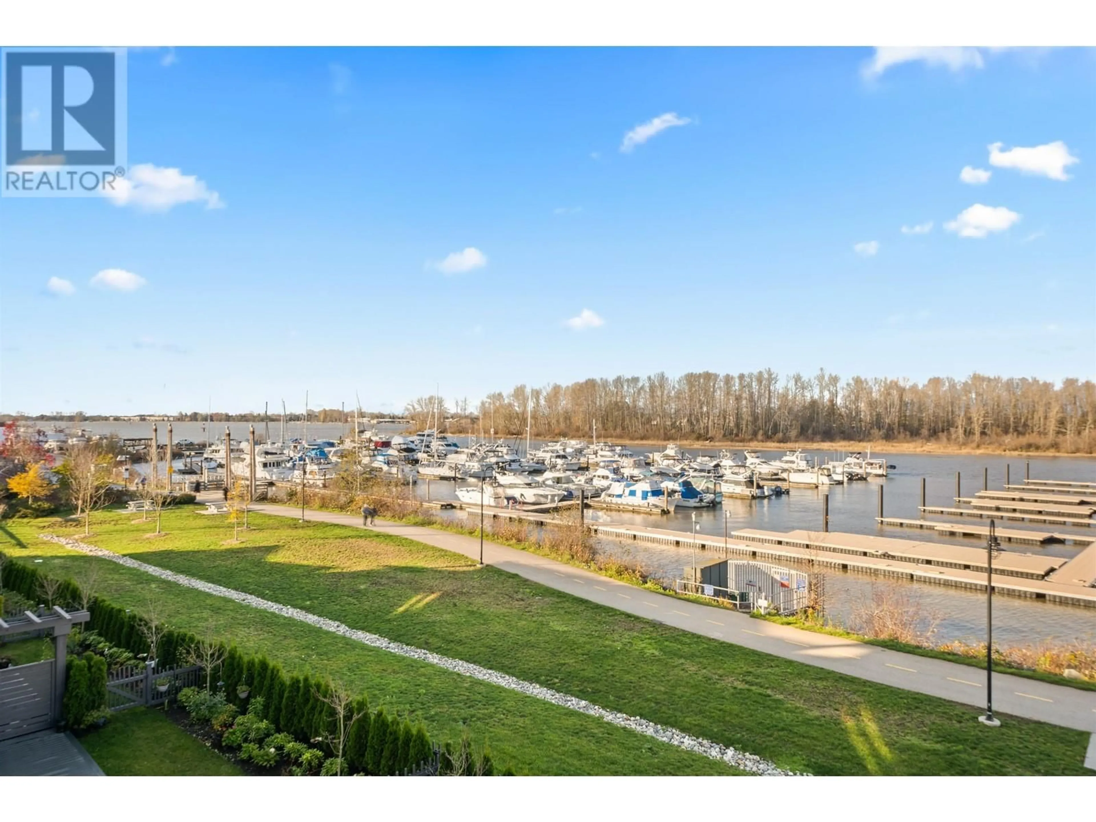 A pic from outside/outdoor area/front of a property/back of a property/a pic from drone, water/lake/river/ocean view for 100 - 5311 ADMIRAL WAY, Delta British Columbia V4K0E2