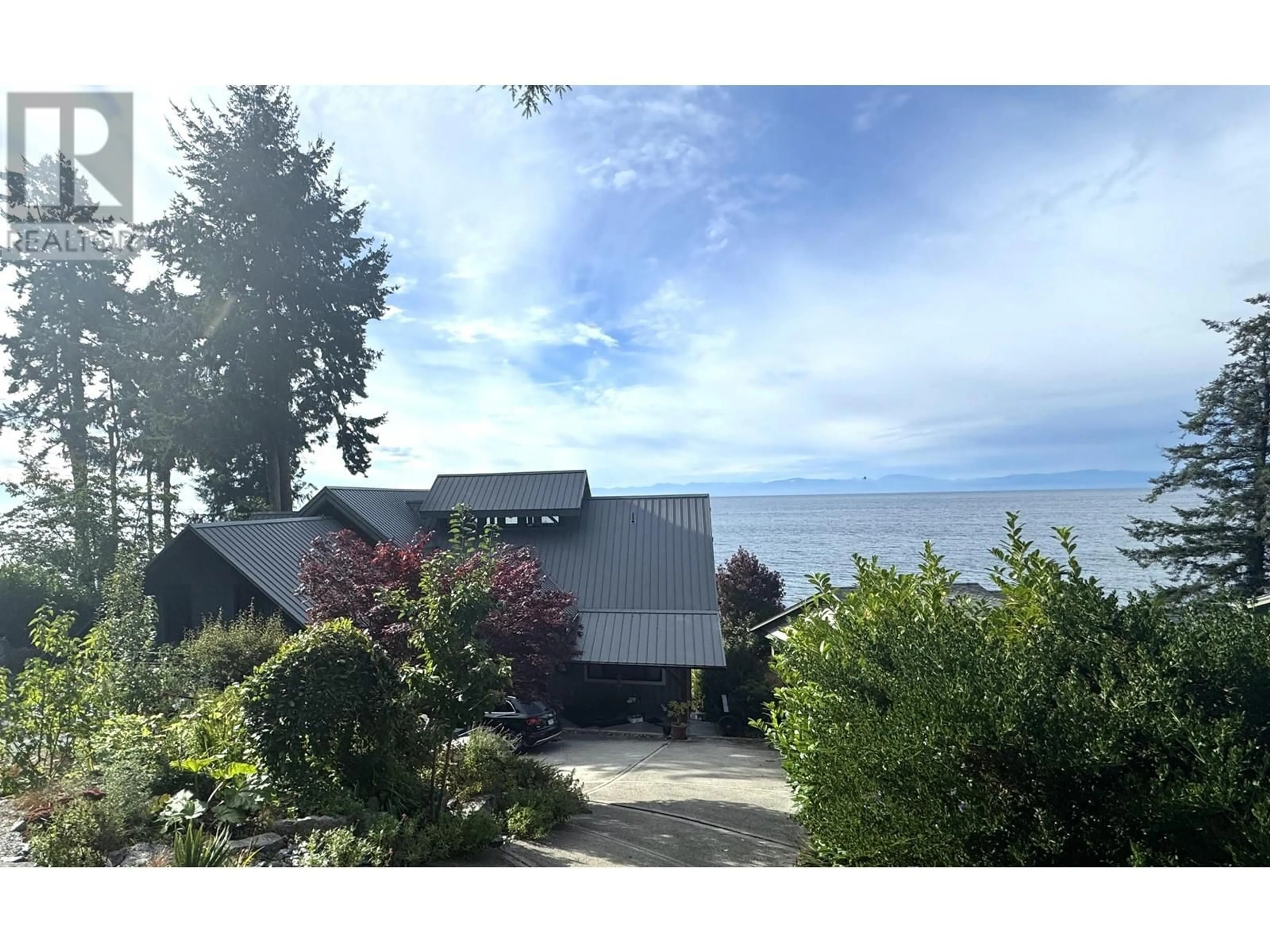 A pic from outside/outdoor area/front of a property/back of a property/a pic from drone, water/lake/river/ocean view for 3387 BEACH AVENUE, Roberts Creek British Columbia V0N2W2