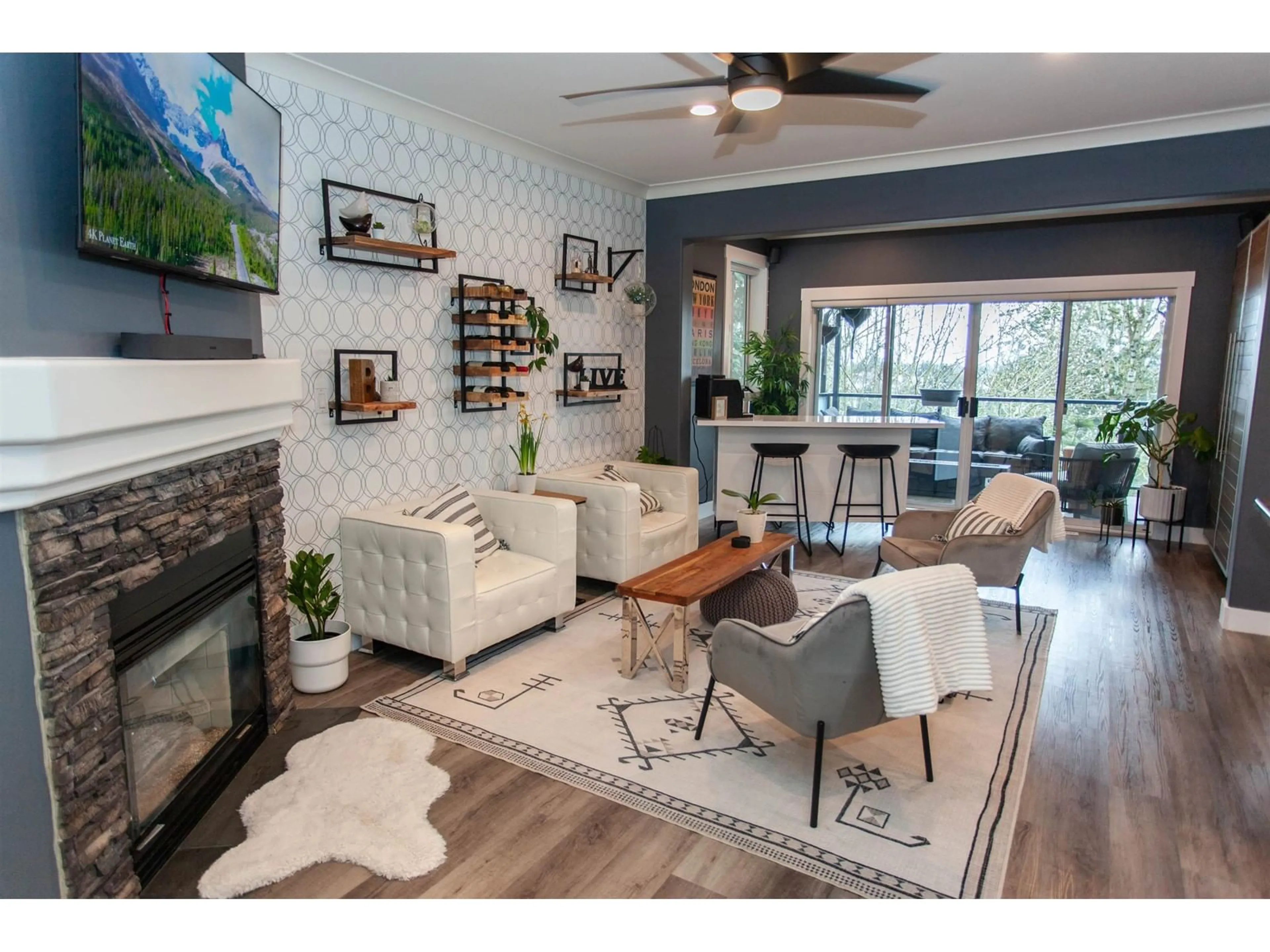 Living room with furniture, wood/laminate floor for 2787 ST MORITZ WAY, Abbotsford British Columbia V3G1C3