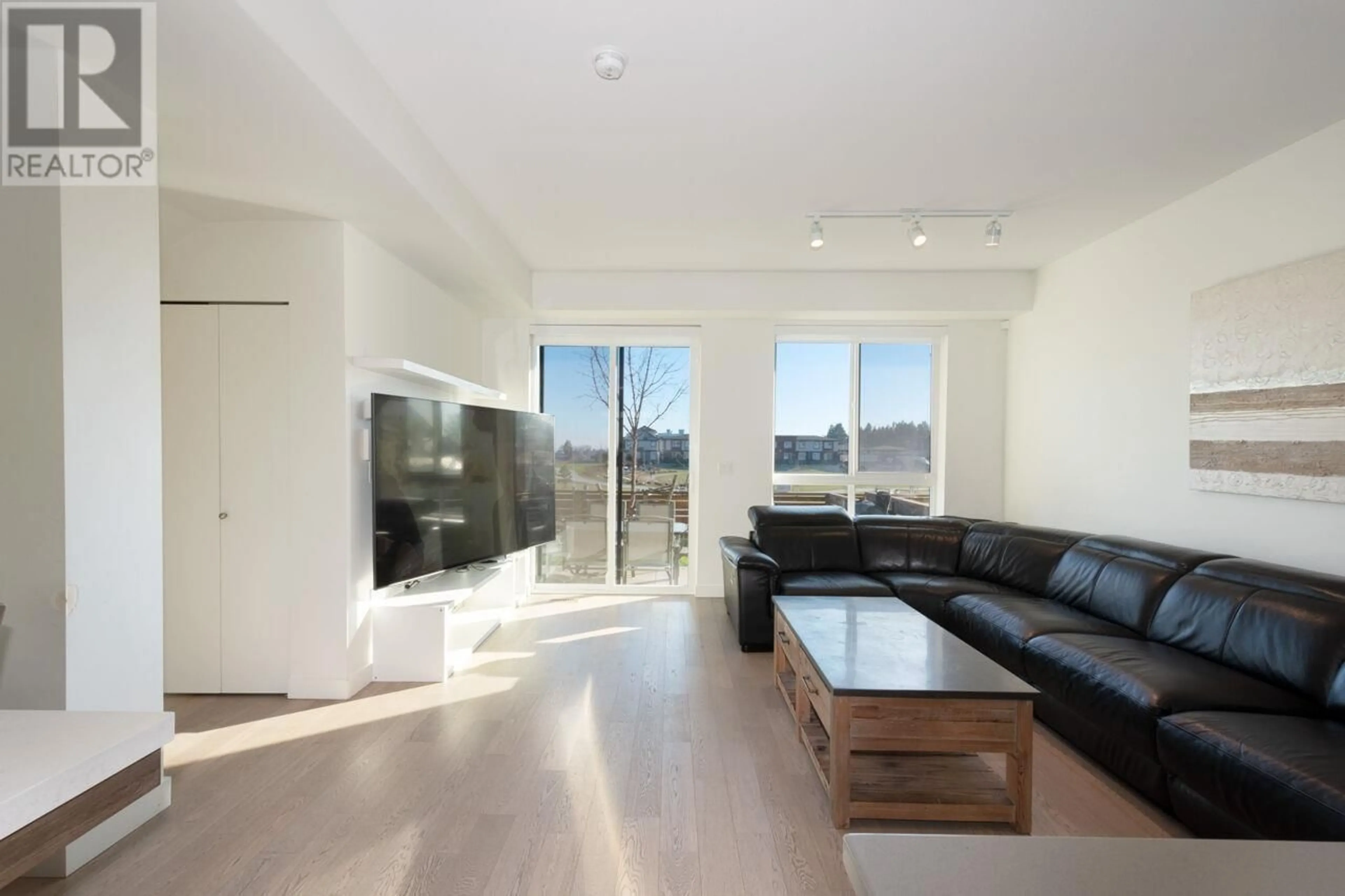 Living room with furniture, wood/laminate floor for 13 - 10233 RIVER DRIVE, Richmond British Columbia V6X0T7