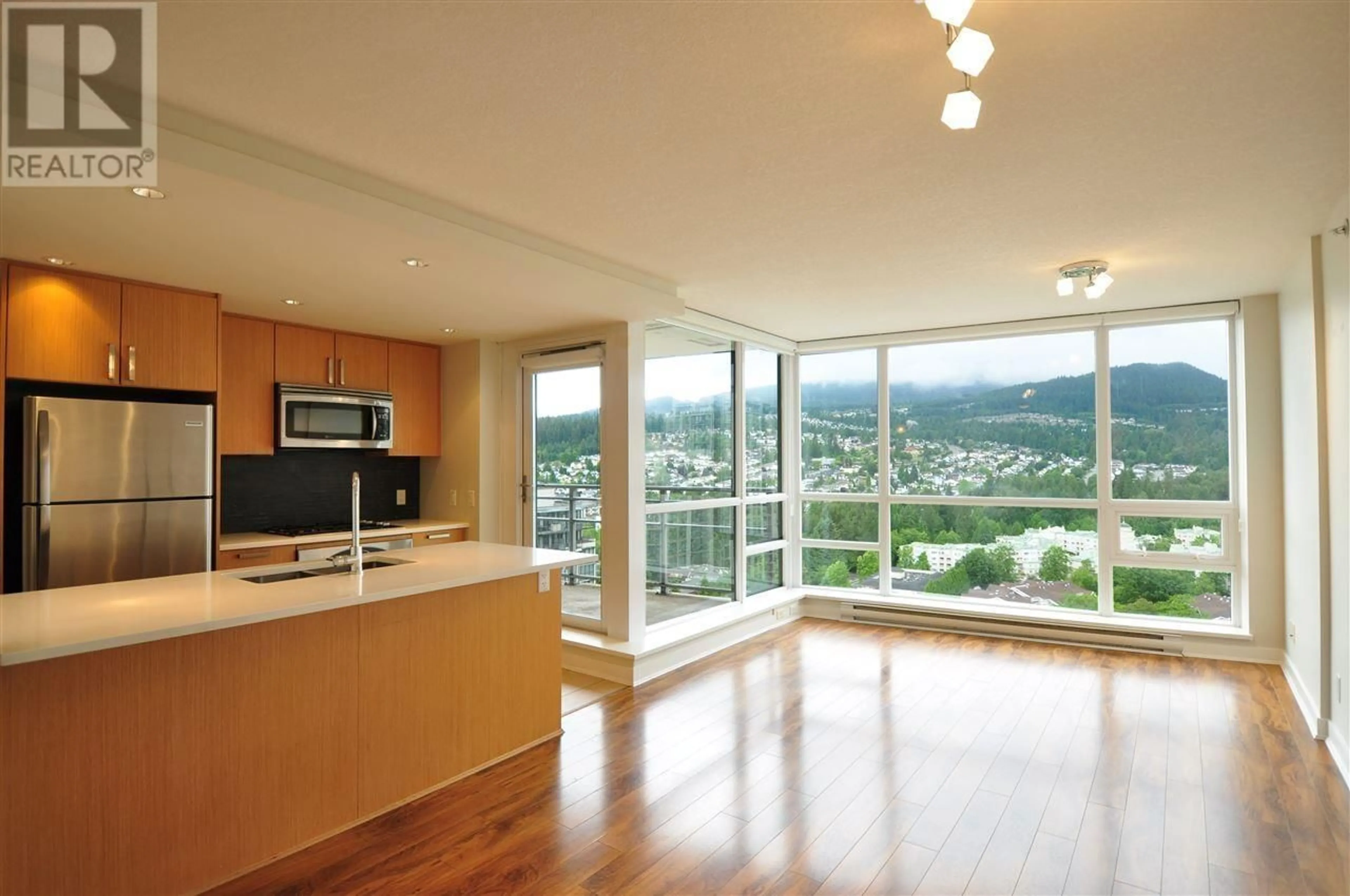 Open concept kitchen, wood/laminate floor for 2601 2978 GLEN DRIVE, Coquitlam British Columbia V3B0C3