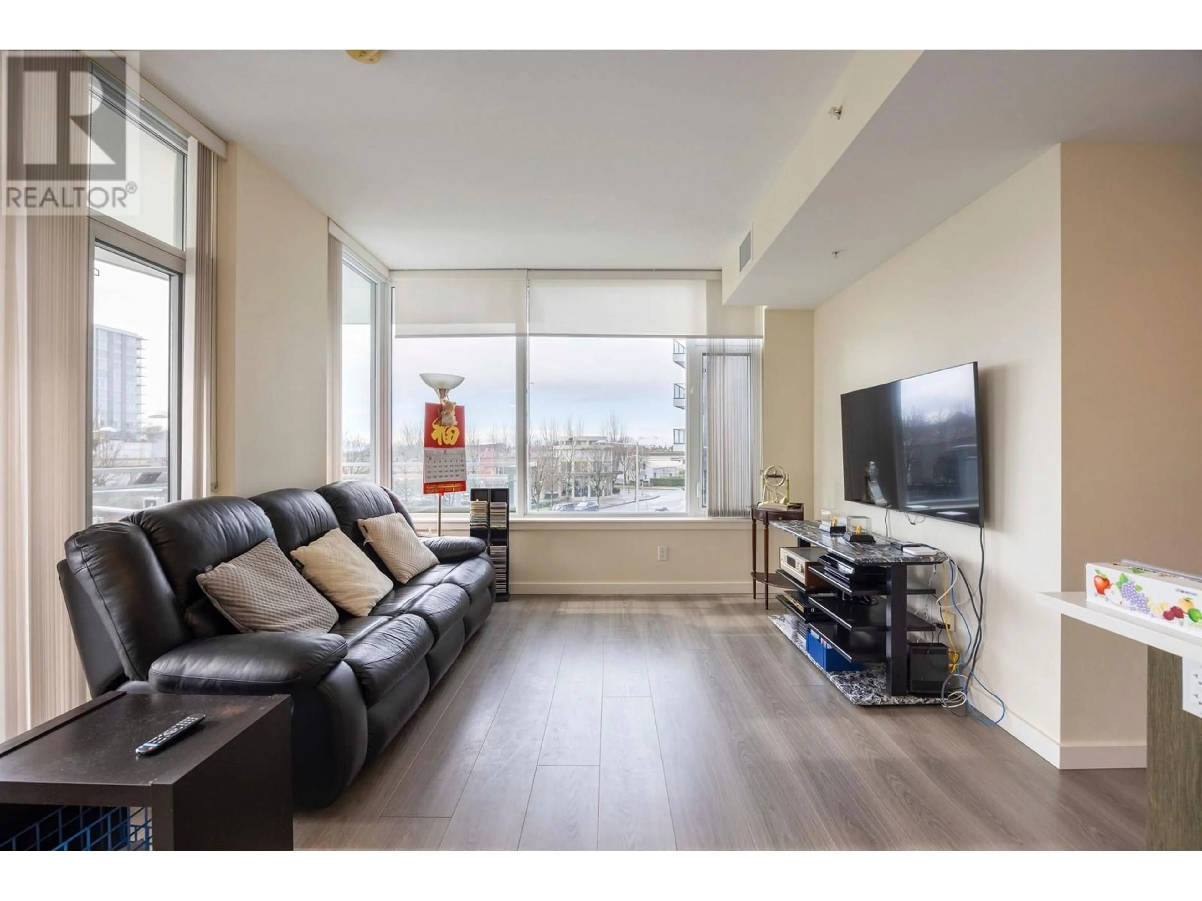 Living room with furniture, wood/laminate floor for 306 - 8633 CAPSTAN WAY, Richmond British Columbia V6X0N5