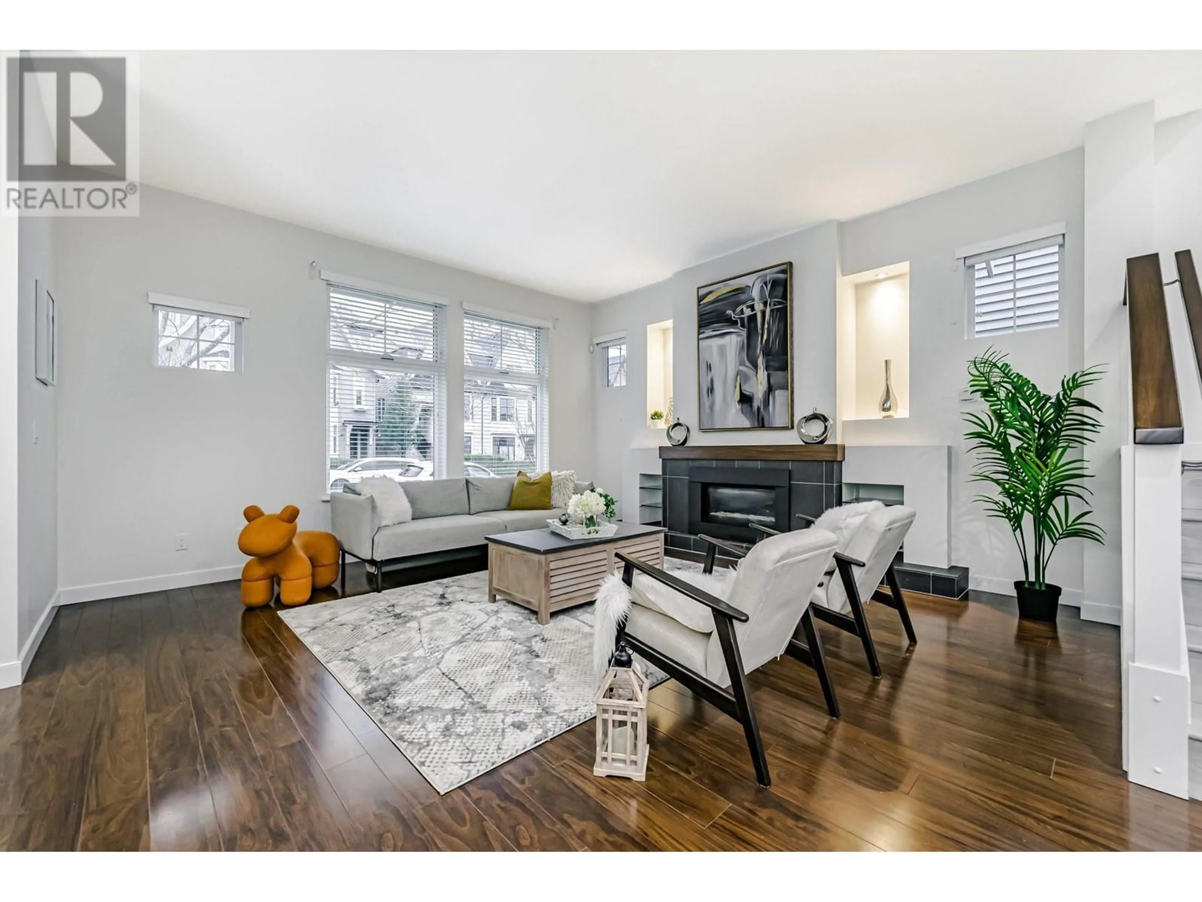 Living room with furniture, wood/laminate floor for 3446 ROXTON AVENUE, Coquitlam British Columbia V3B3H7