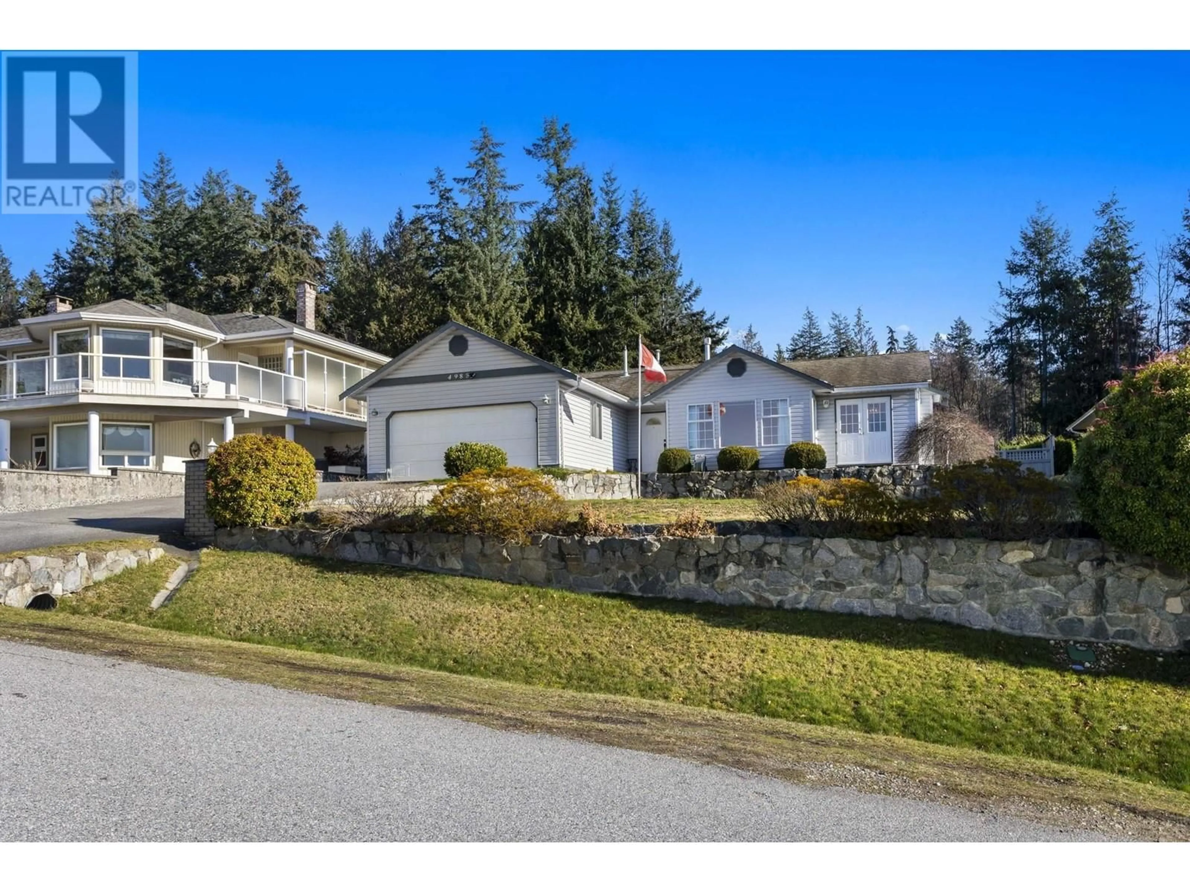 A pic from outside/outdoor area/front of a property/back of a property/a pic from drone, street for 4988 ARBUTUS ROAD, Sechelt British Columbia V7Z0B8