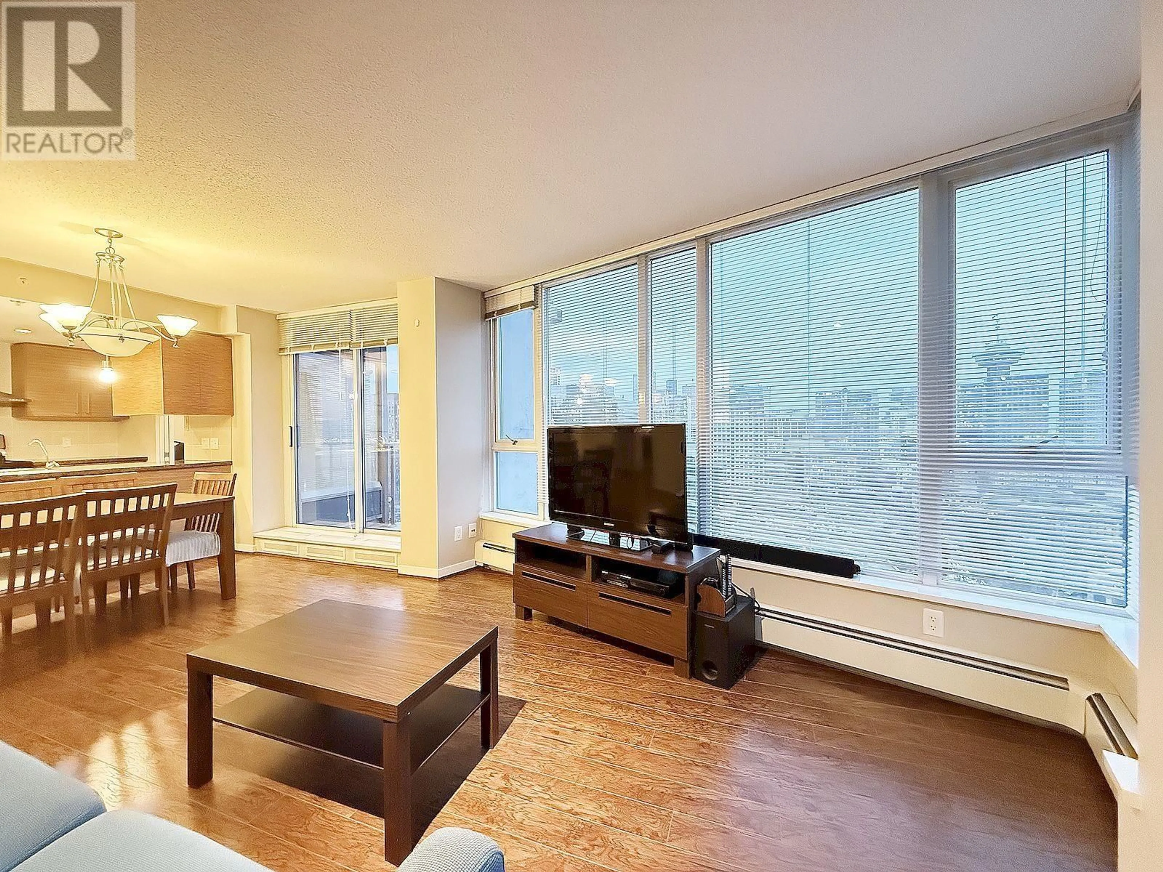 Living room with furniture, wood/laminate floor for 3103 188 KEEFER PLACE, Vancouver British Columbia V6B0J1