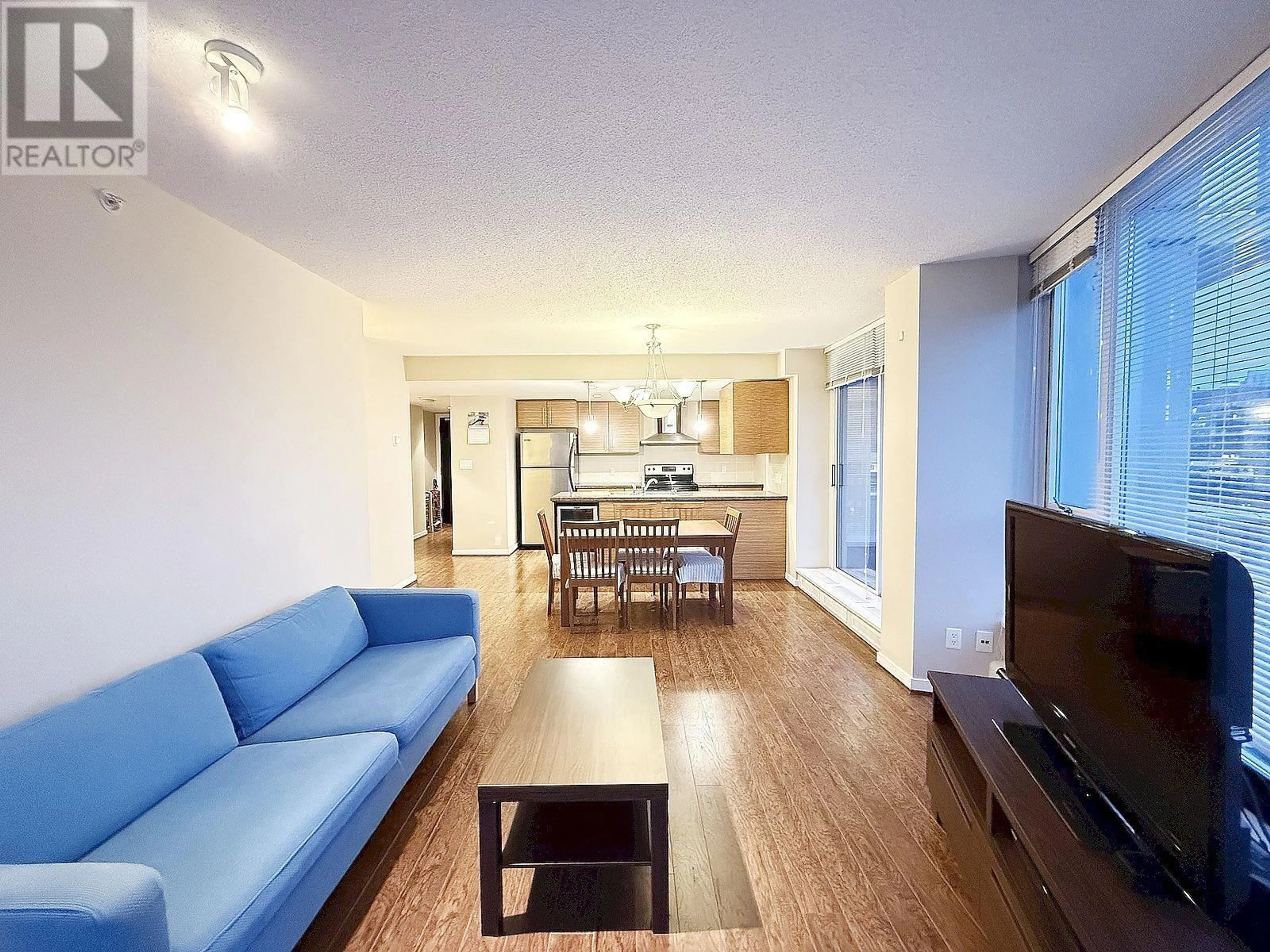 Living room with furniture, wood/laminate floor for 3103 188 KEEFER PLACE, Vancouver British Columbia V6B0J1