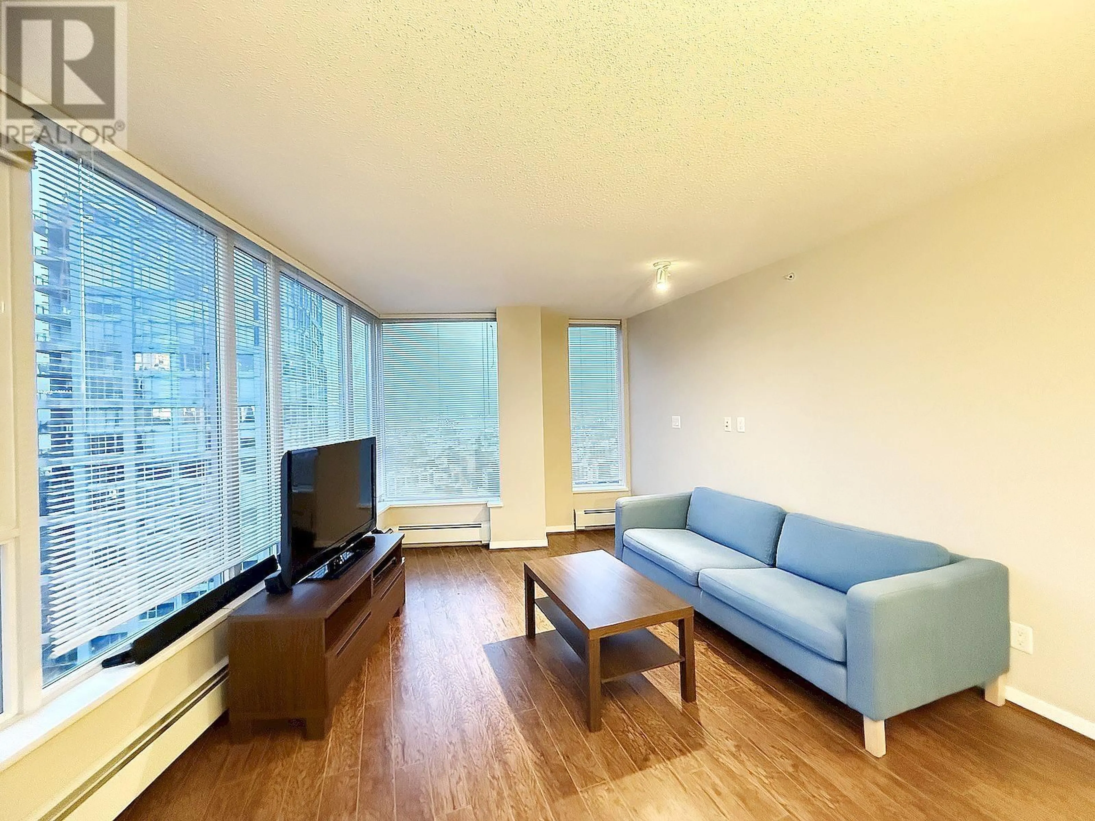 Living room with furniture, wood/laminate floor for 3103 188 KEEFER PLACE, Vancouver British Columbia V6B0J1