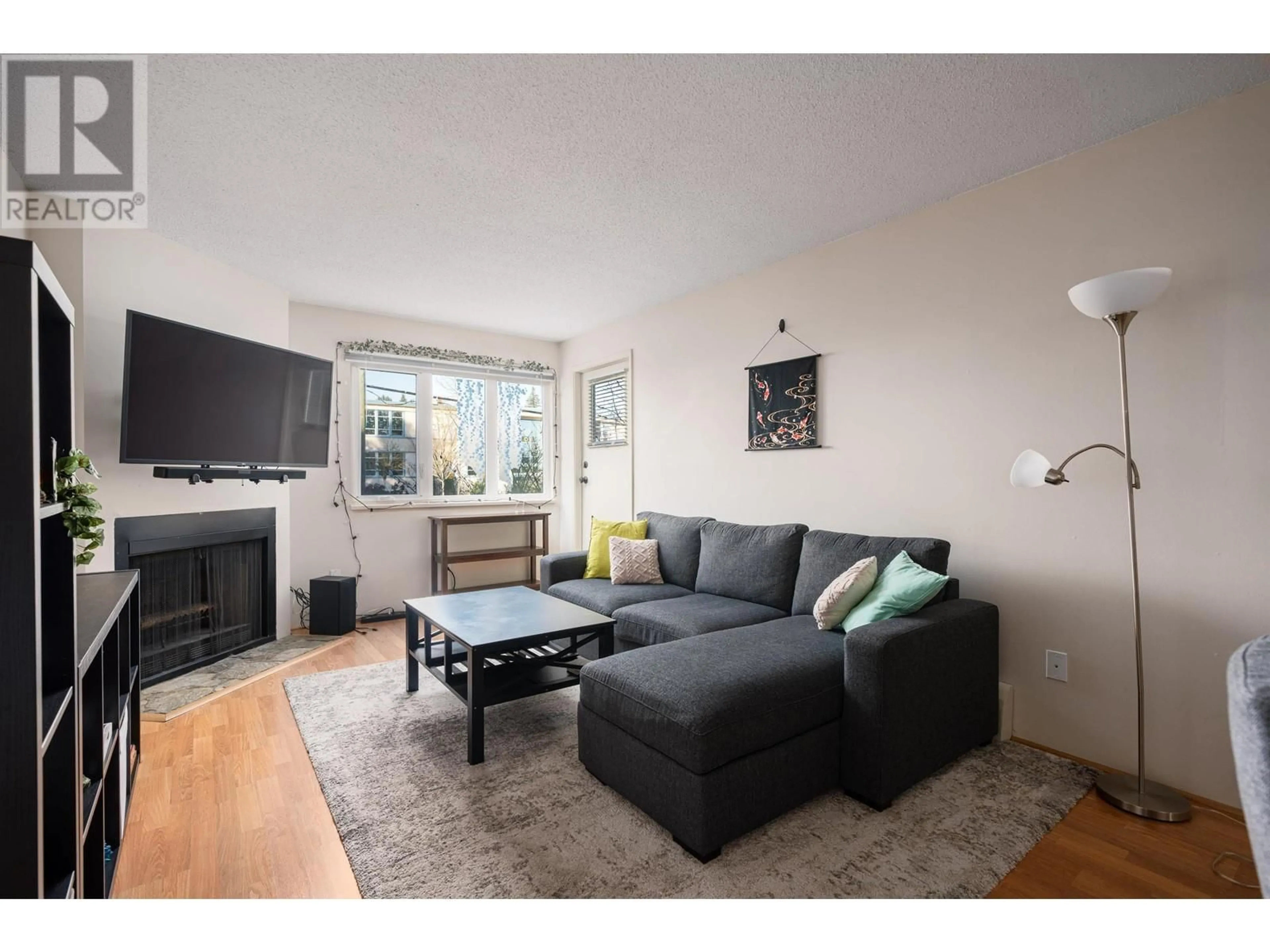 Living room with furniture, wood/laminate floor for 207 1122 KING ALBERT AVENUE, Coquitlam British Columbia V3J1X7