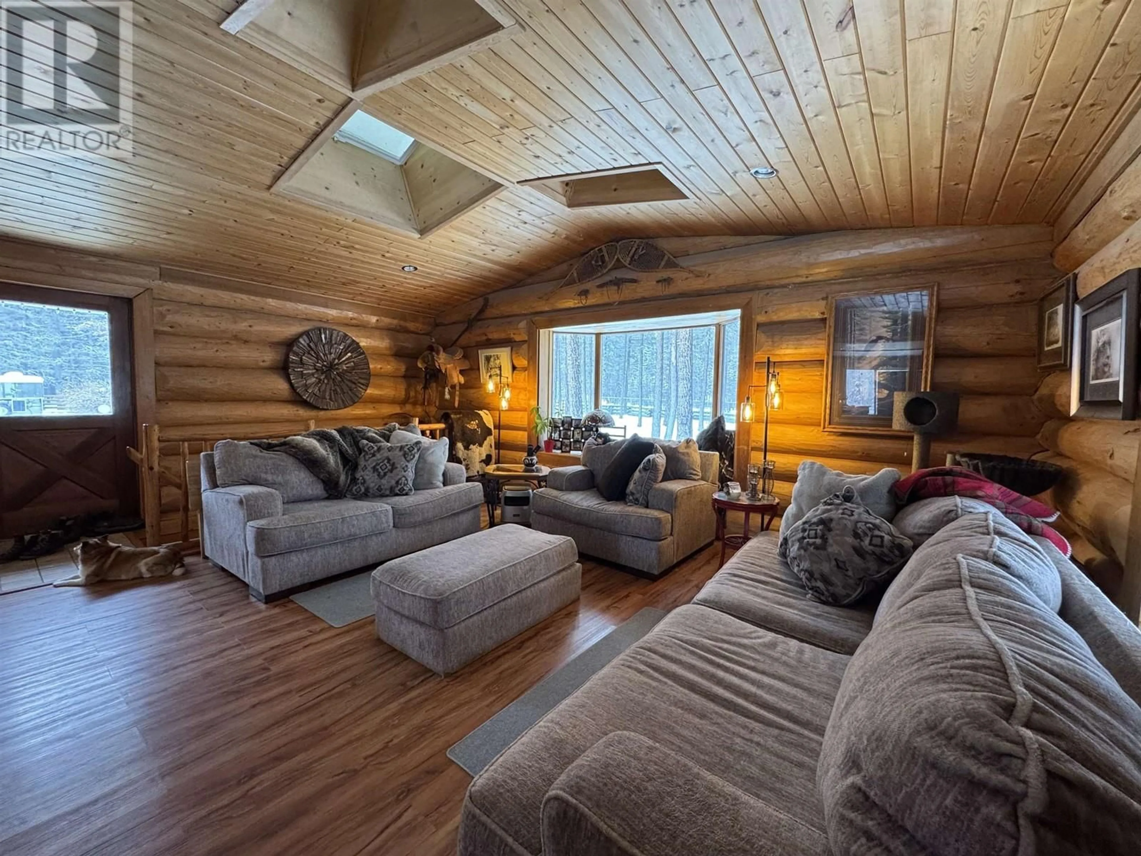 Living room with furniture, wood/laminate floor for 409 PHEASANT DRIVE, Williams Lake British Columbia V2G5A9