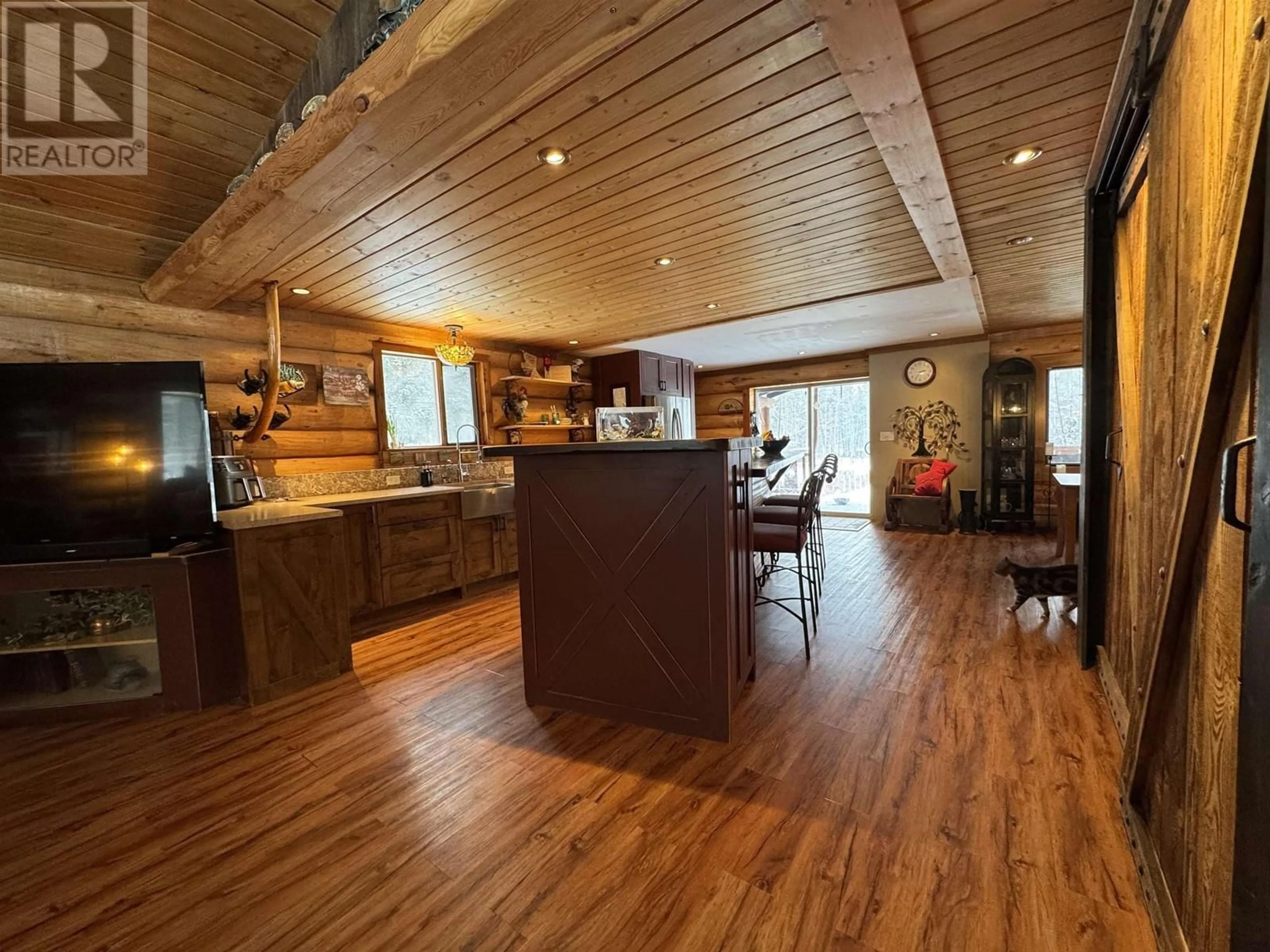 Open concept kitchen, wood/laminate floor for 409 PHEASANT DRIVE, Williams Lake British Columbia V2G5A9
