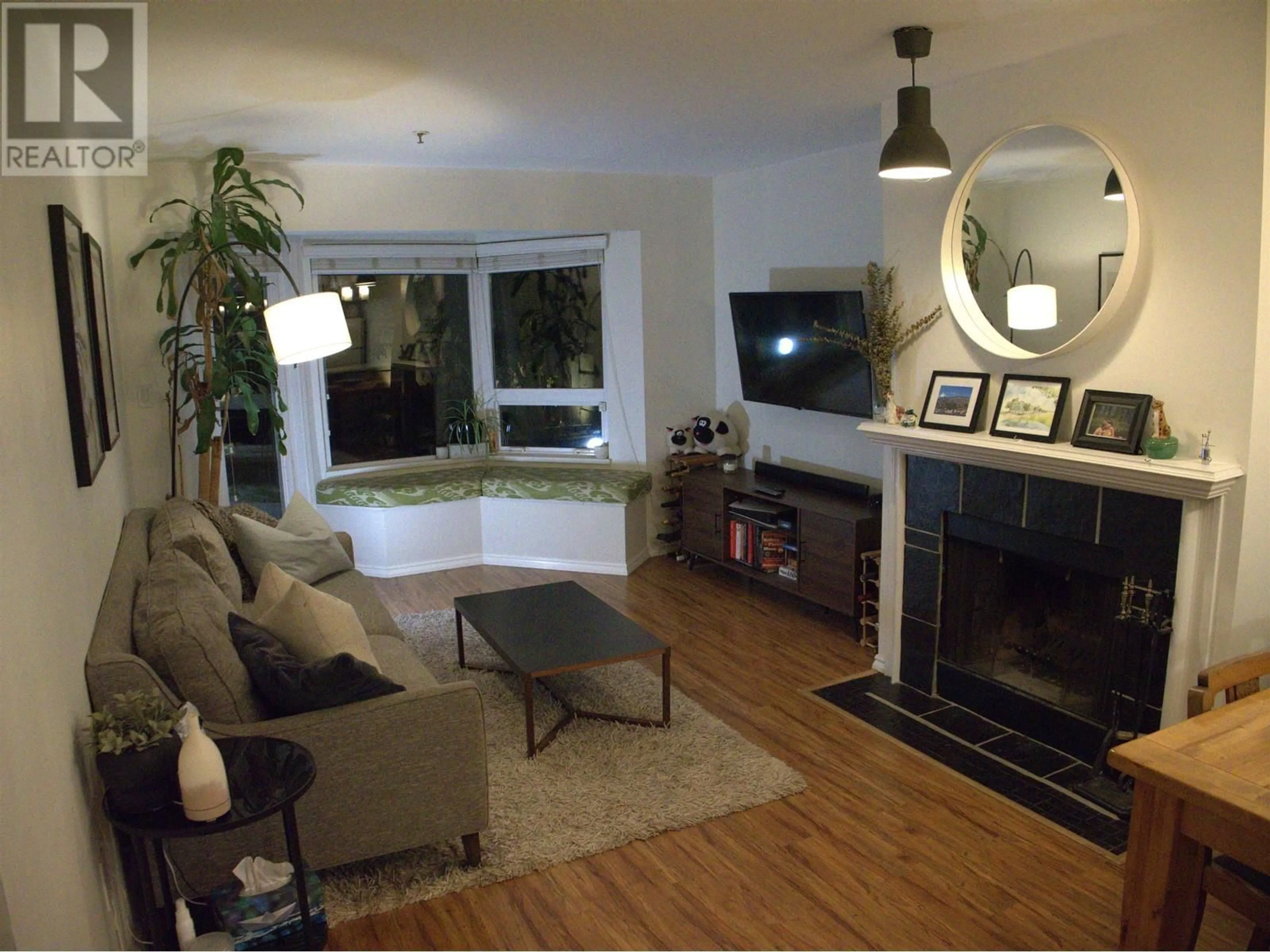 Living room with furniture, wood/laminate floor for 102 1925 W 2ND AVENUE, Vancouver British Columbia V6J1J2