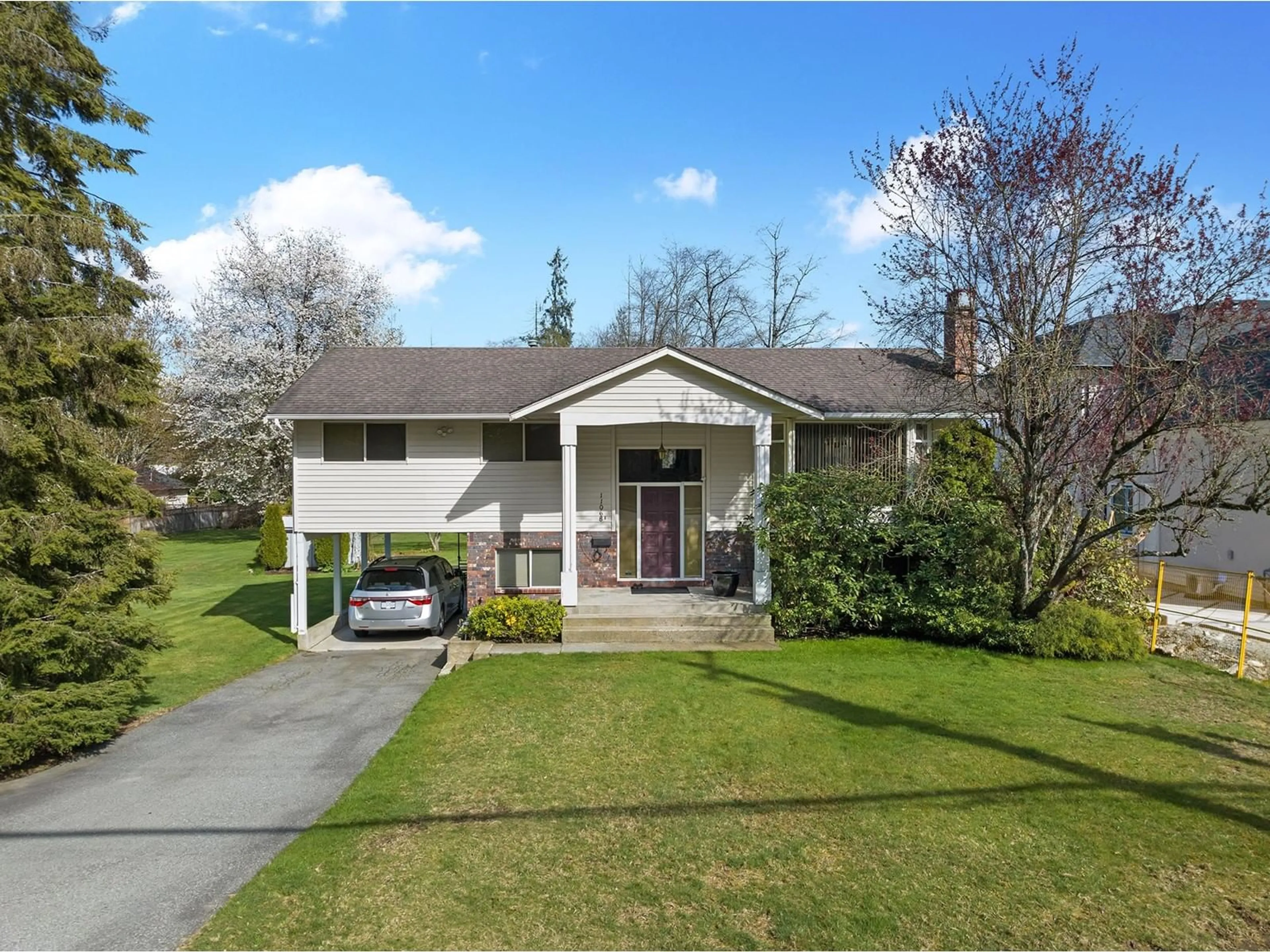 Home with vinyl exterior material, street for 11068 156, Surrey British Columbia V3R6J8