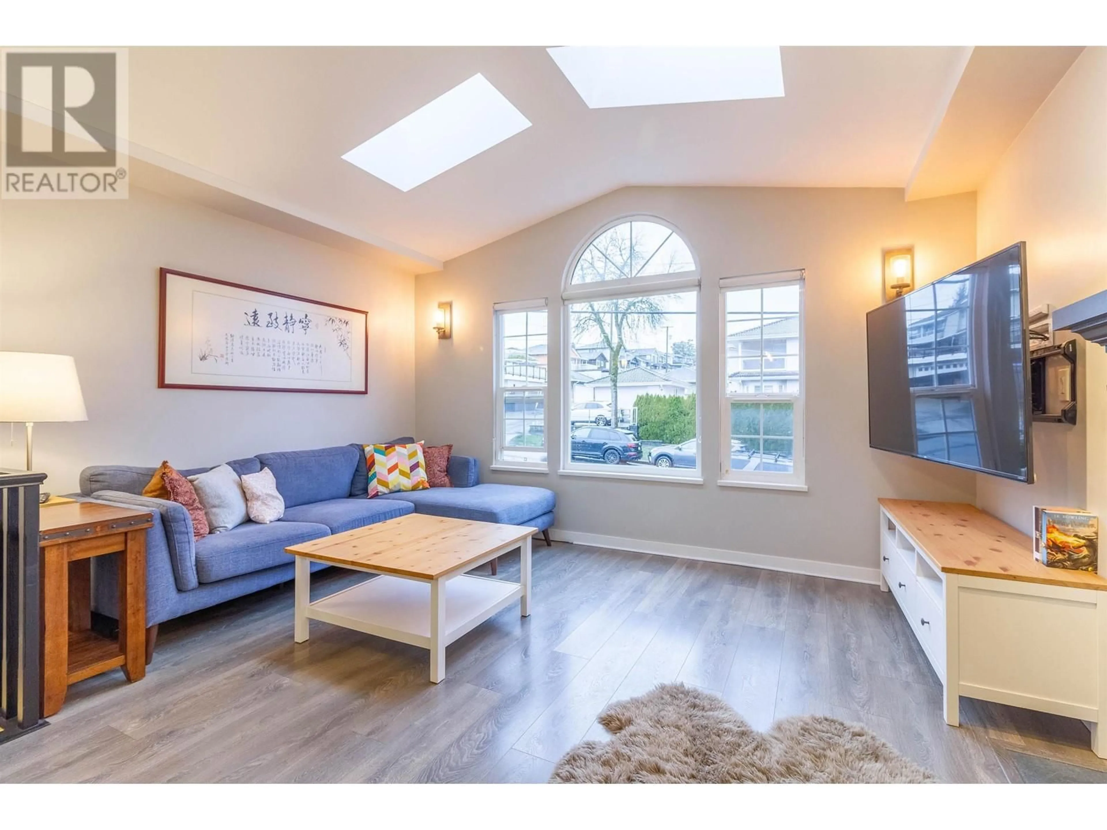 Living room with furniture, wood/laminate floor for 4322 GRAVELEY STREET, Burnaby British Columbia V5C3T8