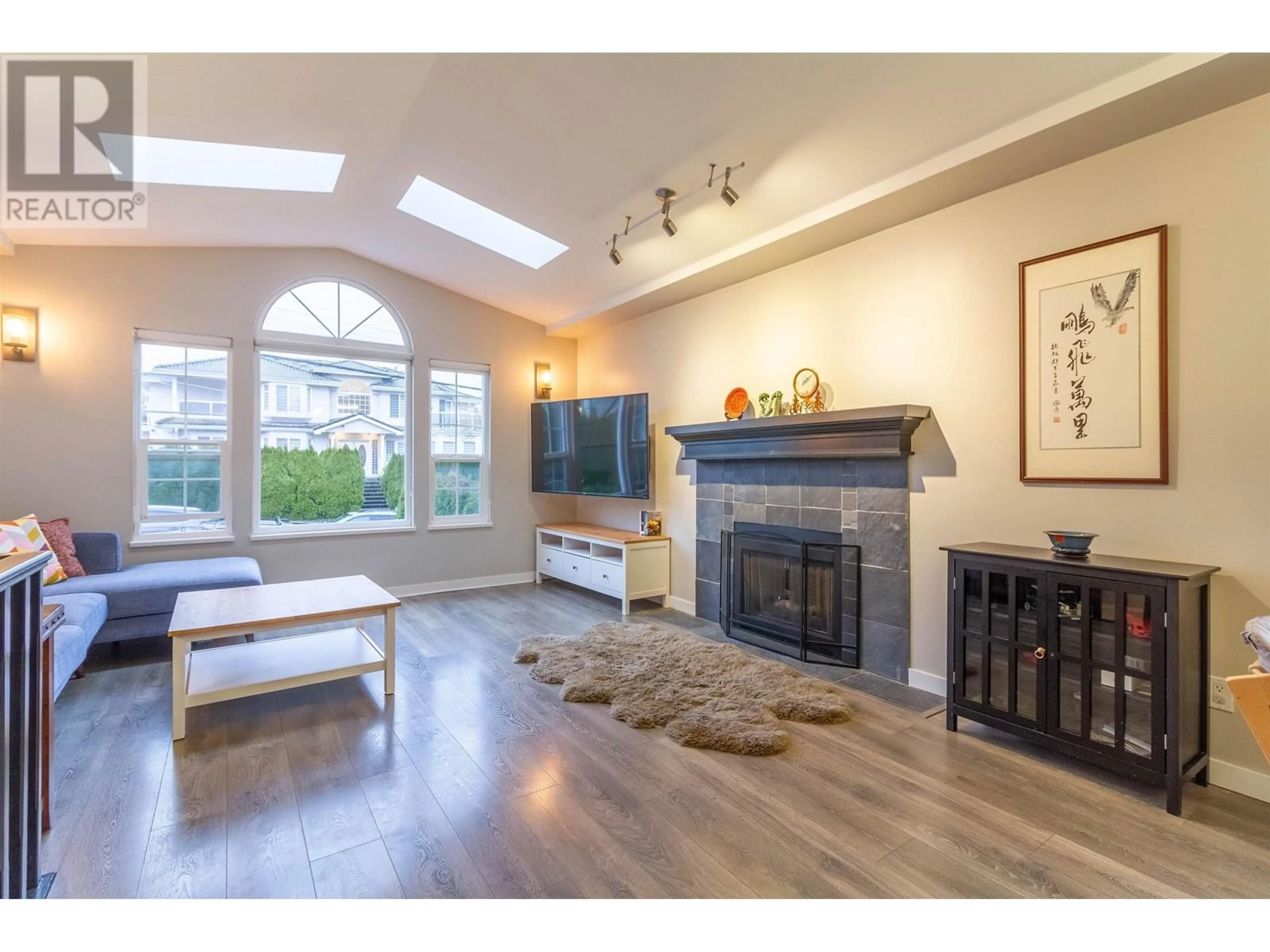 Living room with furniture, wood/laminate floor for 4322 GRAVELEY STREET, Burnaby British Columbia V5C3T8