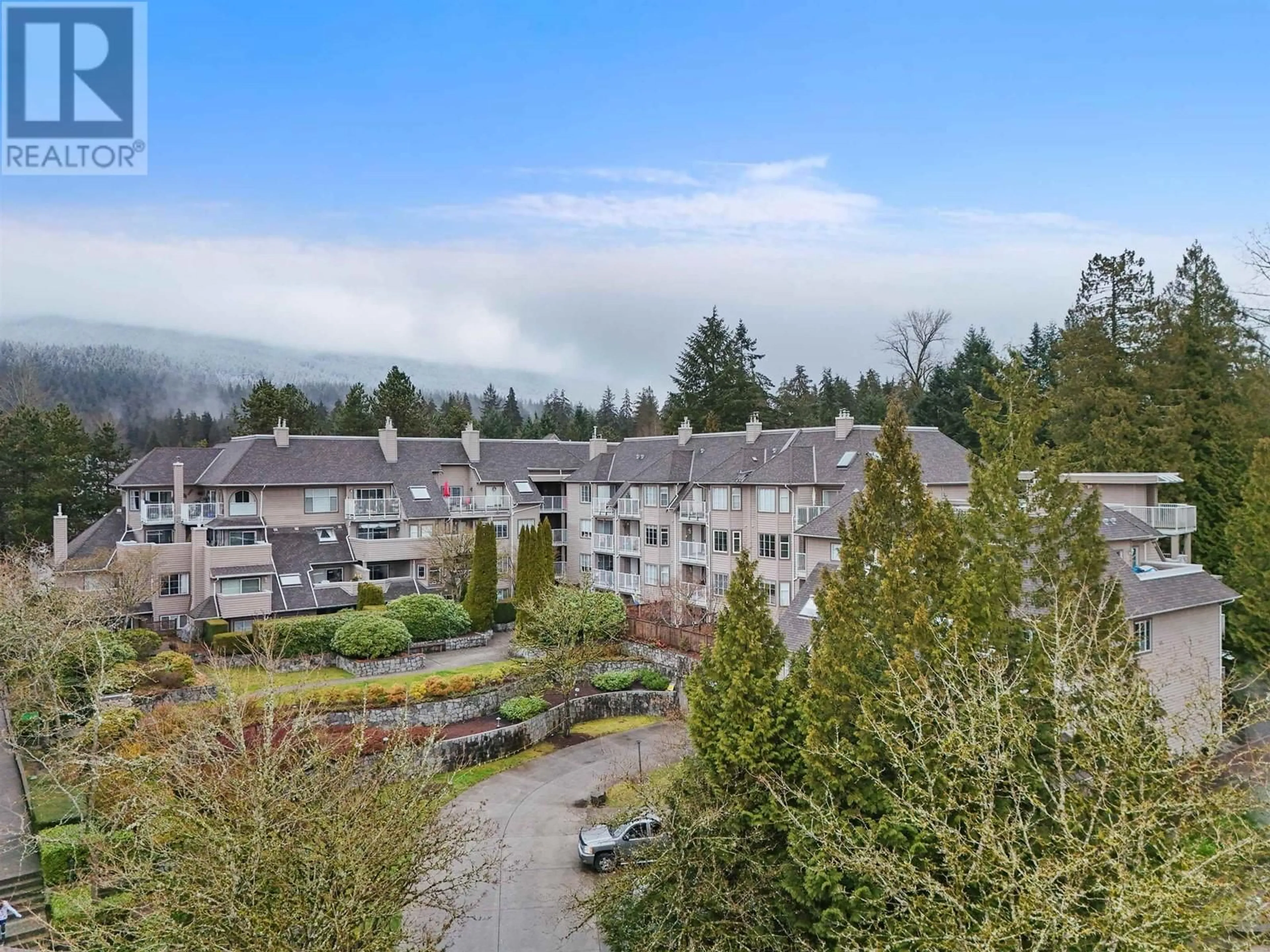 A pic from outside/outdoor area/front of a property/back of a property/a pic from drone, mountain view for 309 1050 BOWRON COURT, North Vancouver British Columbia V7H2X6