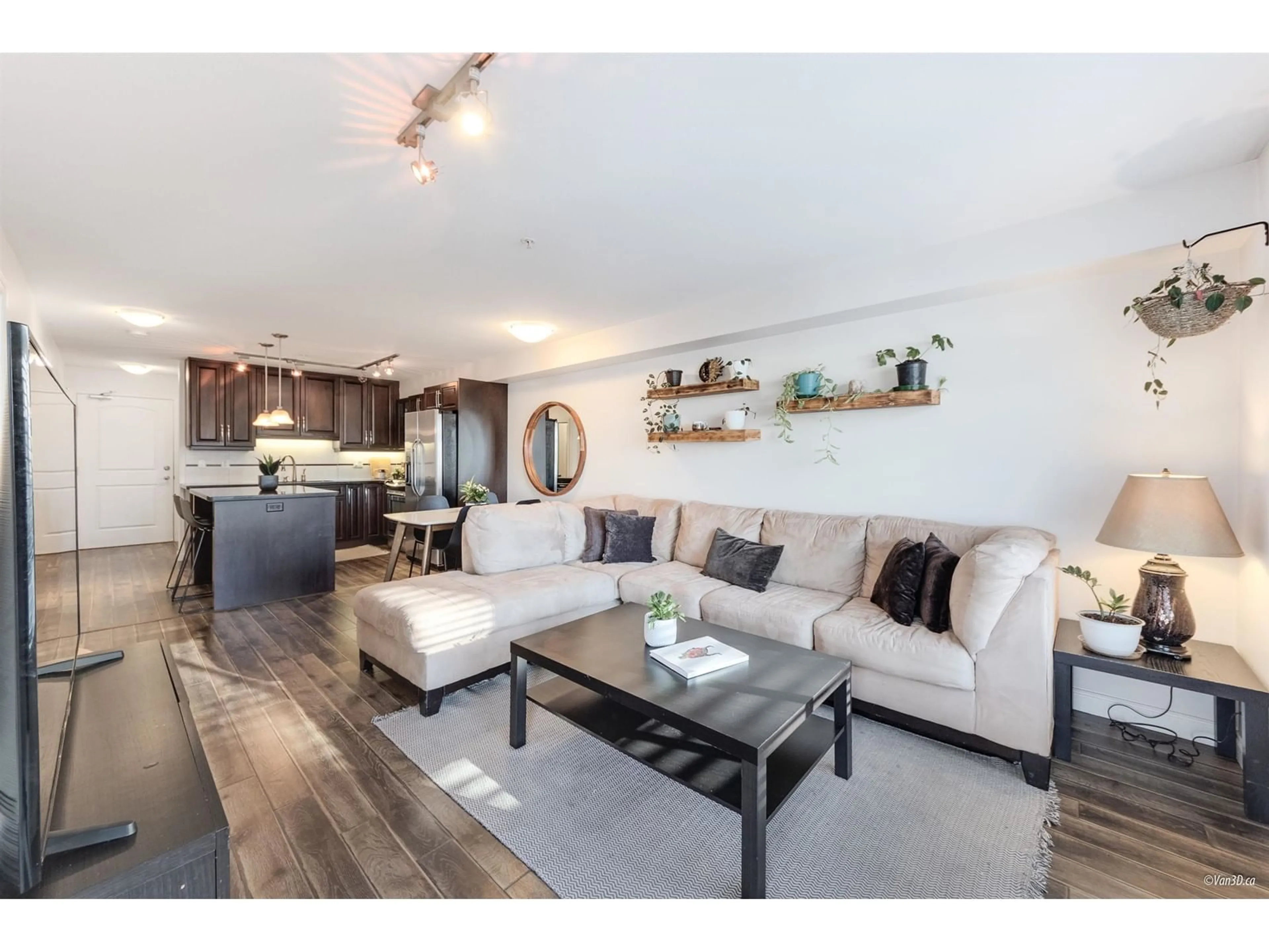 Living room with furniture, wood/laminate floor for 211 - 19939 55A, Langley British Columbia V3A3X4