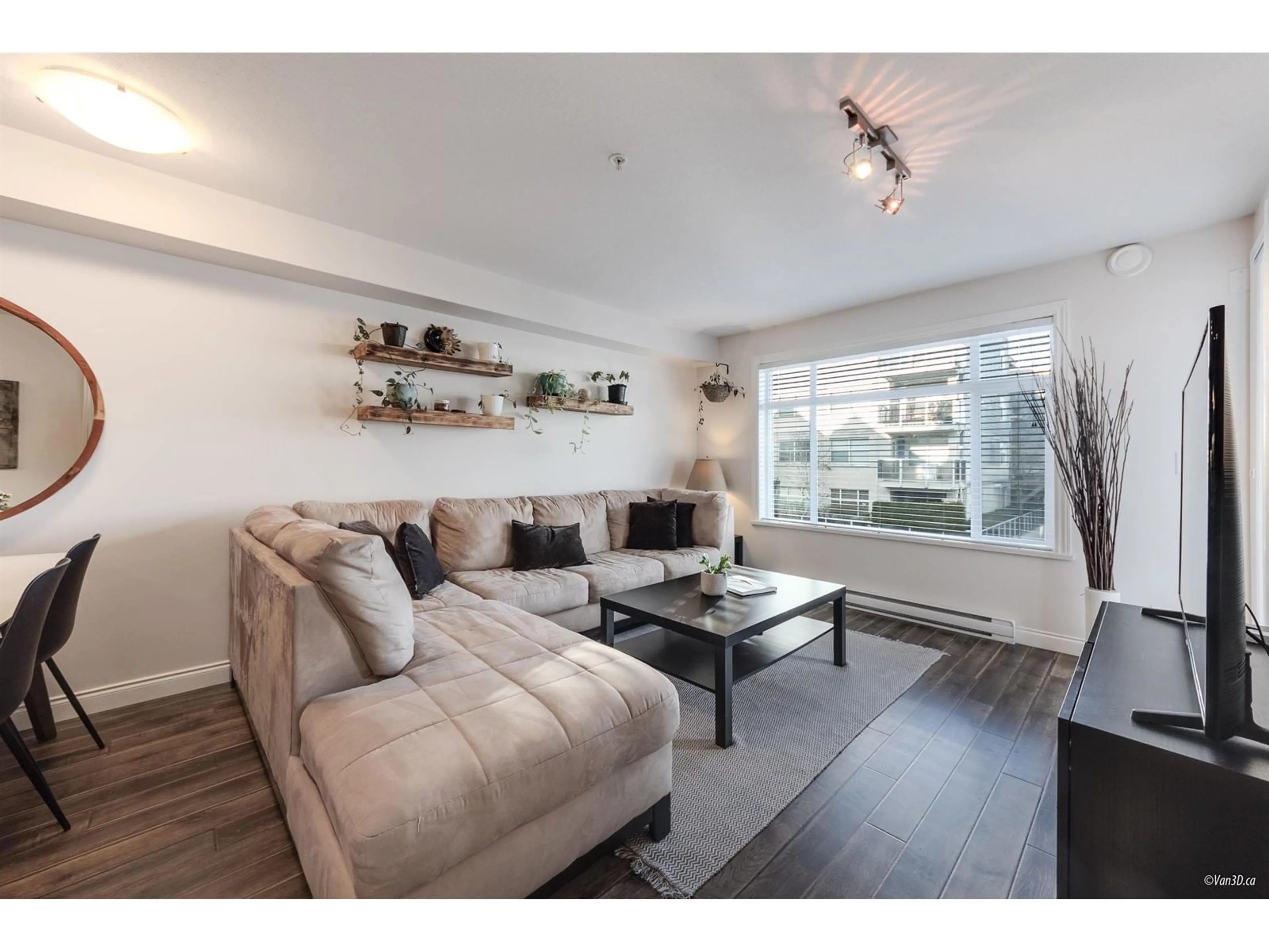 Living room with furniture, wood/laminate floor for 211 - 19939 55A, Langley British Columbia V3A3X4